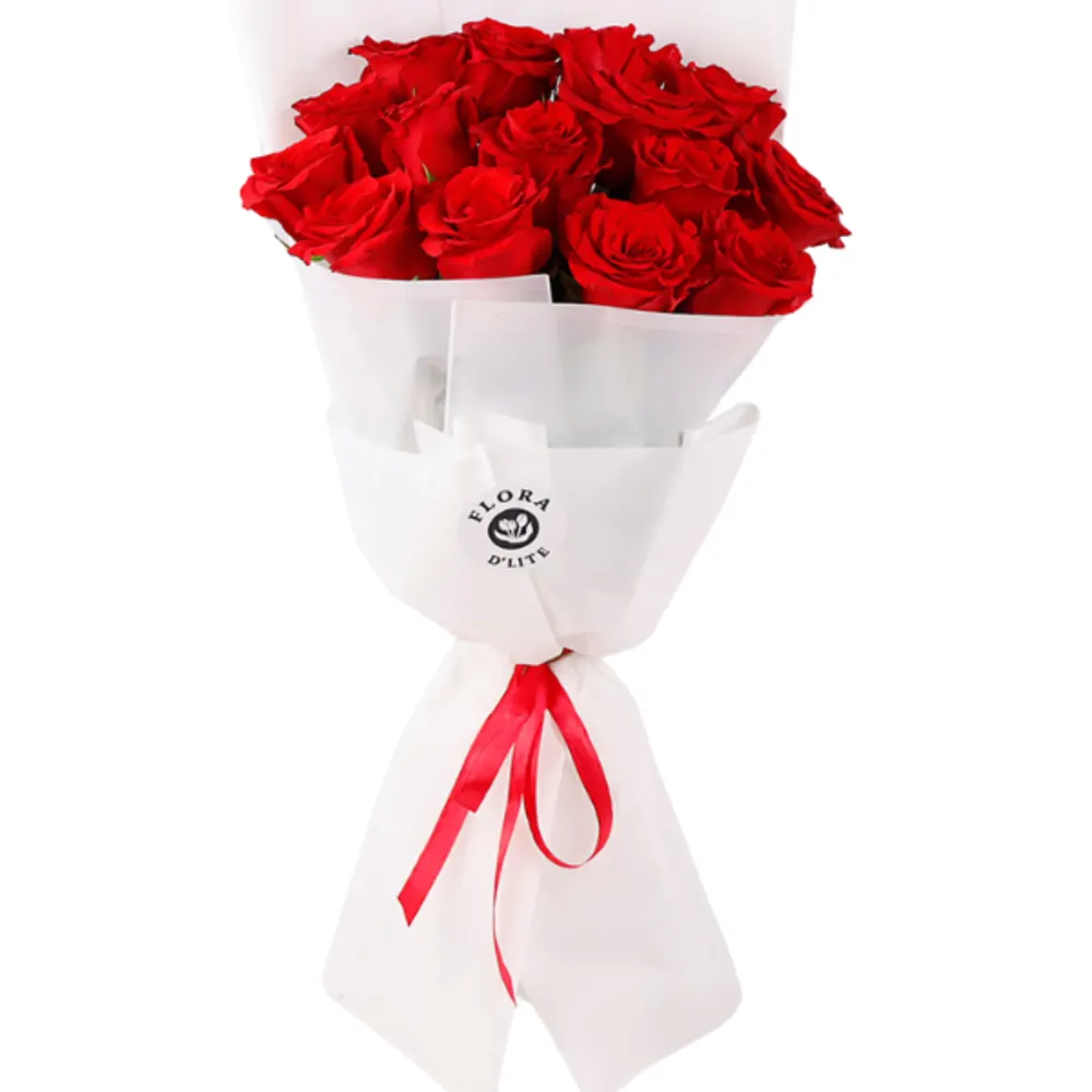 A bouquet of red roses with a white wrapper