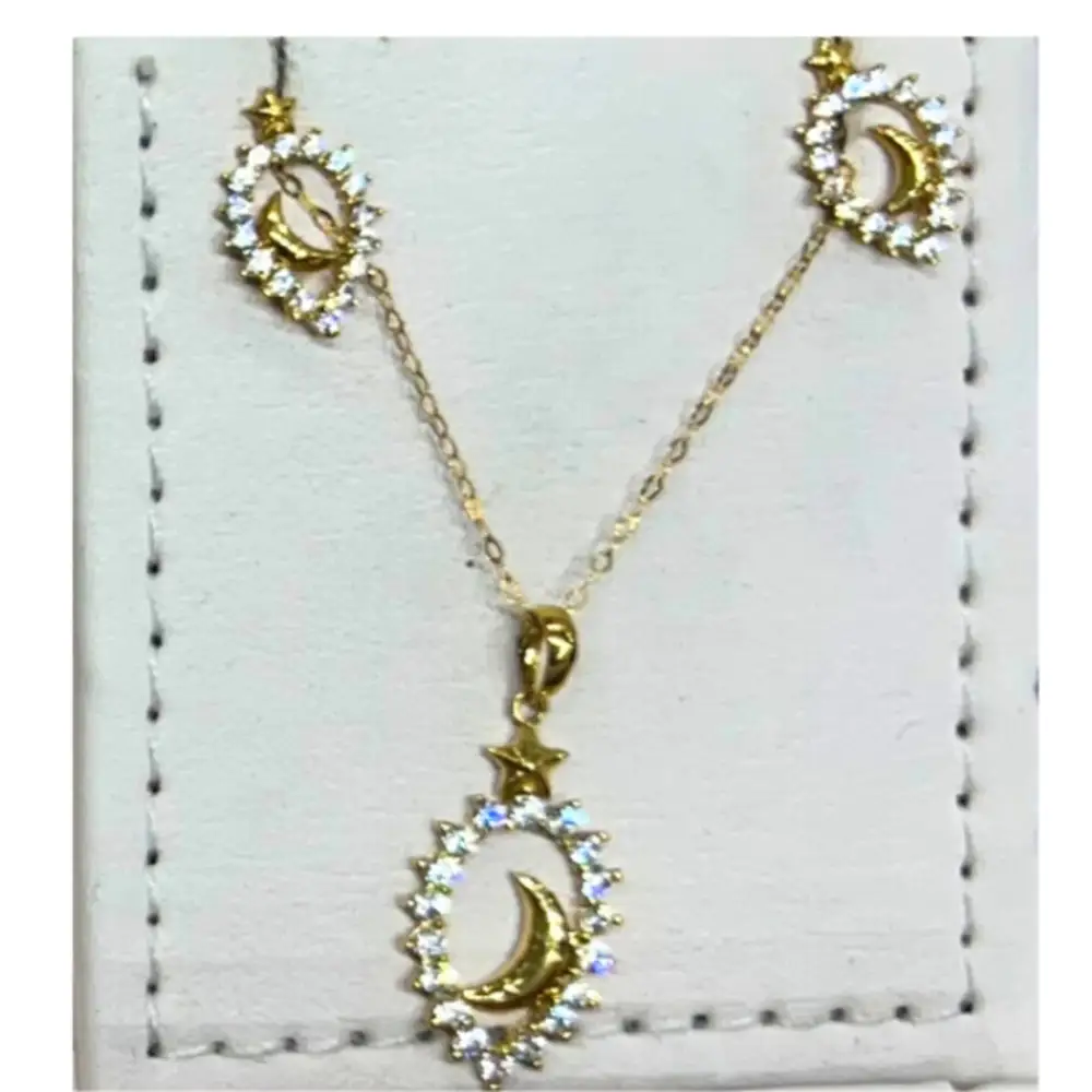 Chain with an oval pendant containing a crescent moon 2