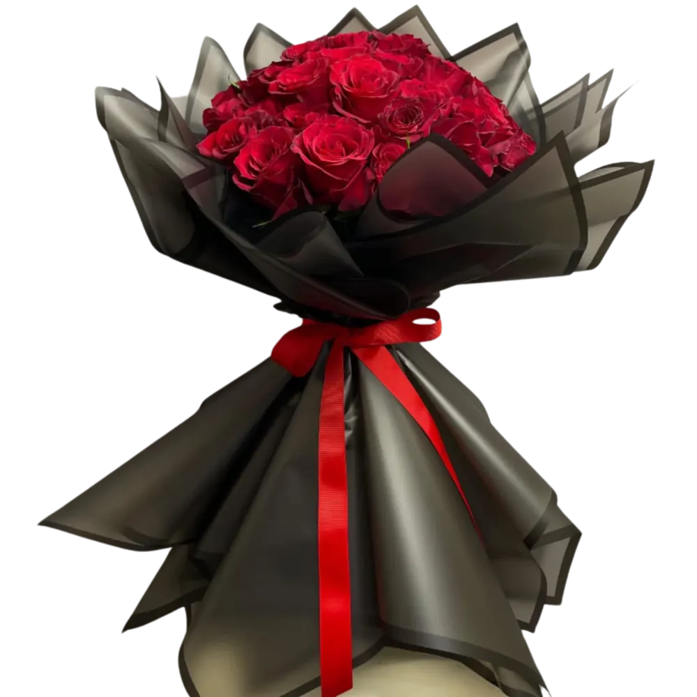A bouquet of red roses with a black wrapper