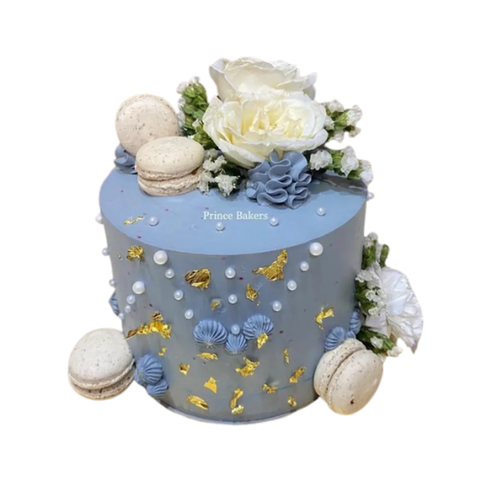 Belgian Chocolate Cake topped with fresh flowers and macrons
