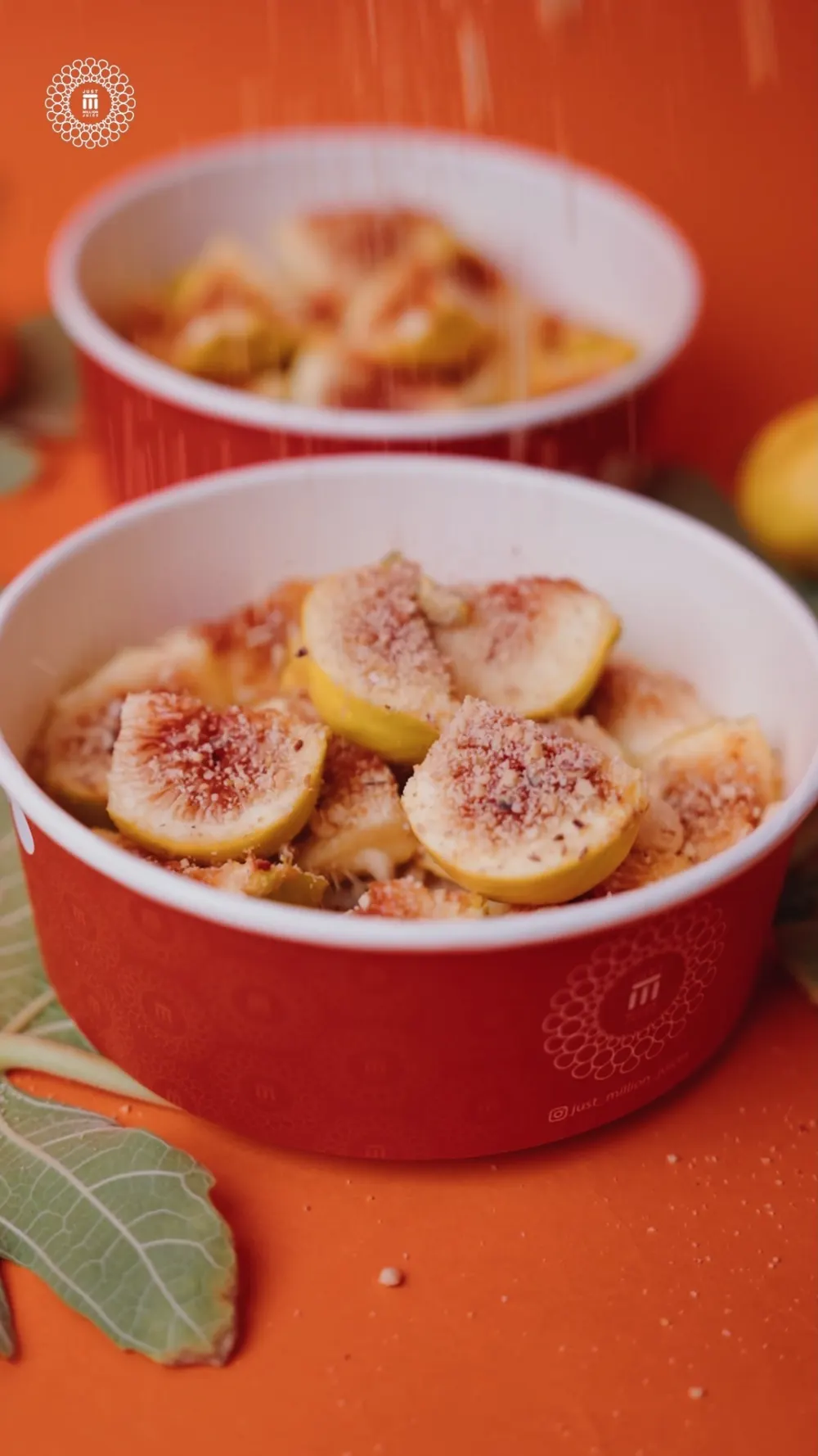 A box of figs with fresh walnuts