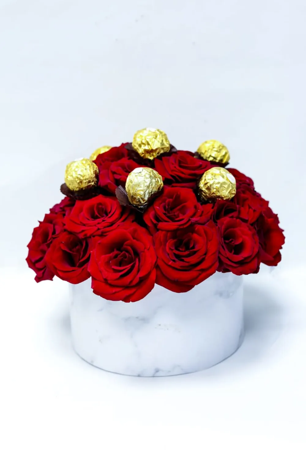A box of elegant, colorful flowers with chocolate !