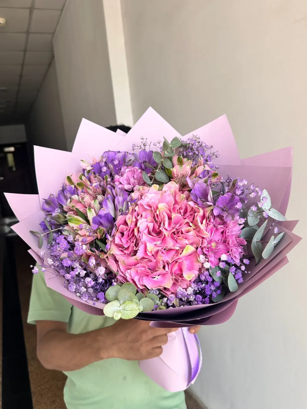 Assorted roses bouquet with purple wrapping