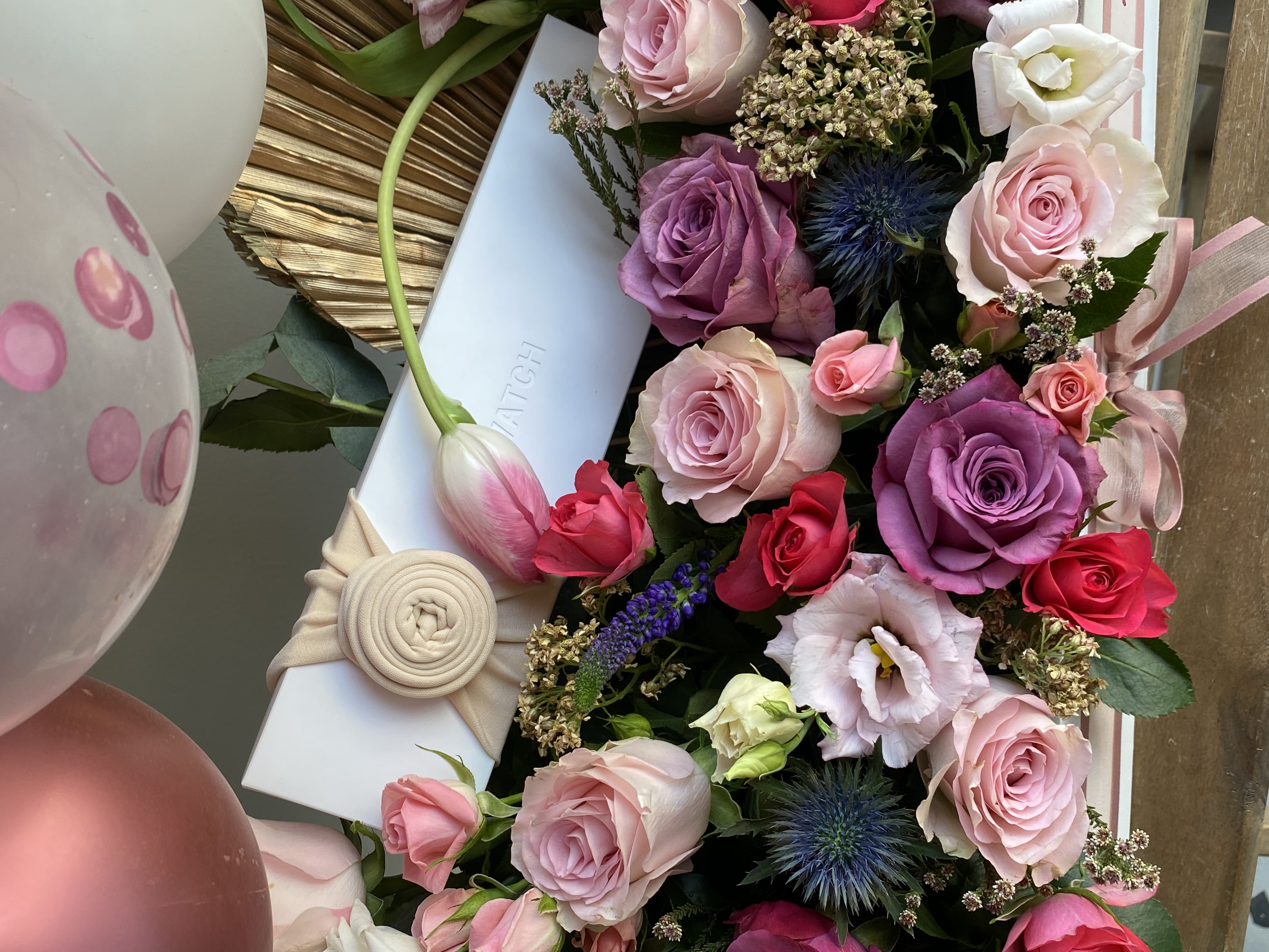 A bouquet of flowers with a watch view 5