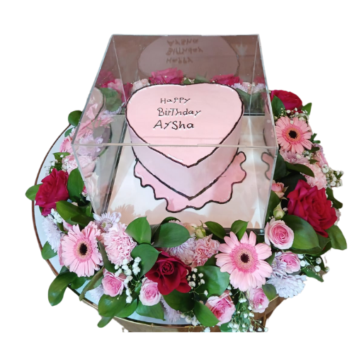 A tray of colorful roses with a pink cake view 1
