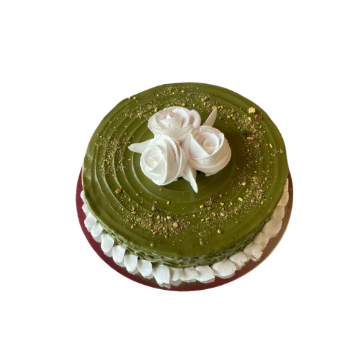 Pistachio cream cake with blue roses in a transparent box view 4