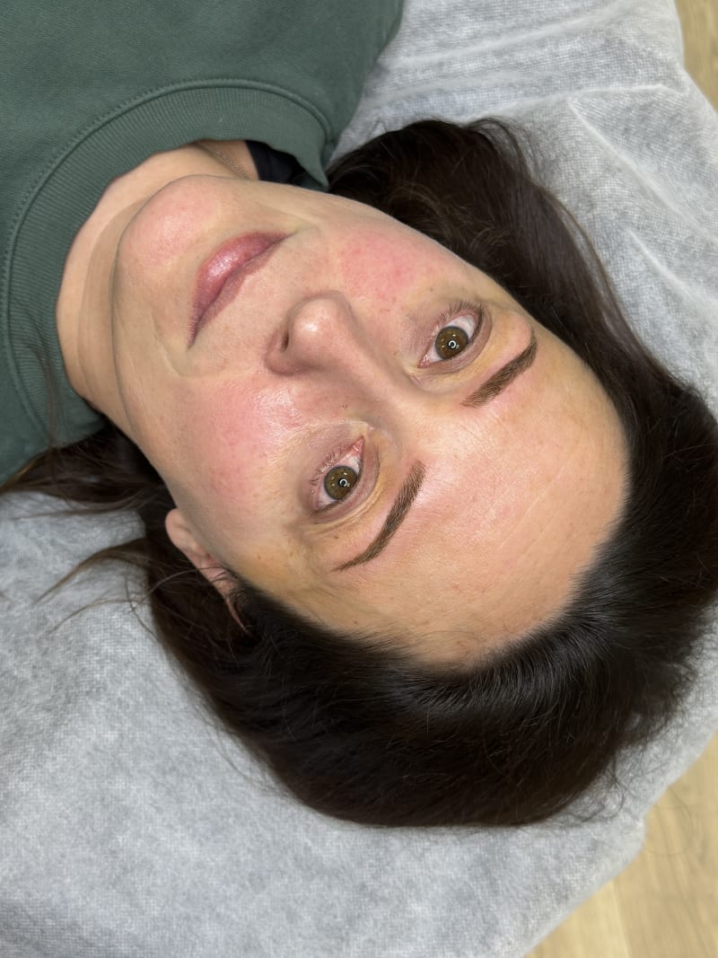 Client showing healed natural microblading result at Nirvana PMU — the test of skill is how brows look at 6 weeks healed