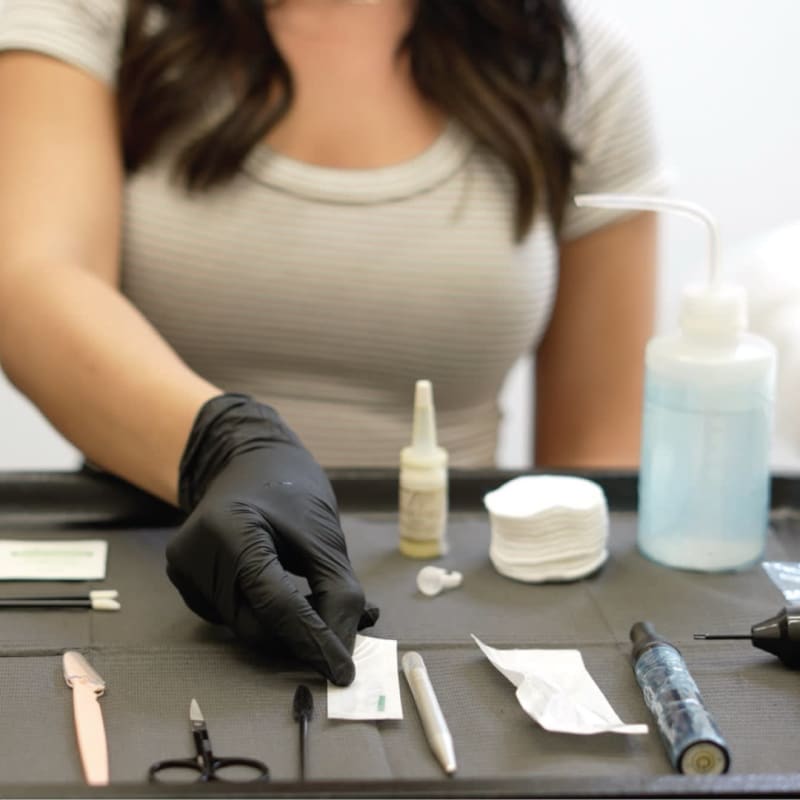 Nirvana PMU studio showing clean workspace with single-use tools and medical-grade equipment