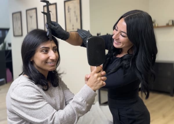 Sarah welcoming clients at Nirvana PMU