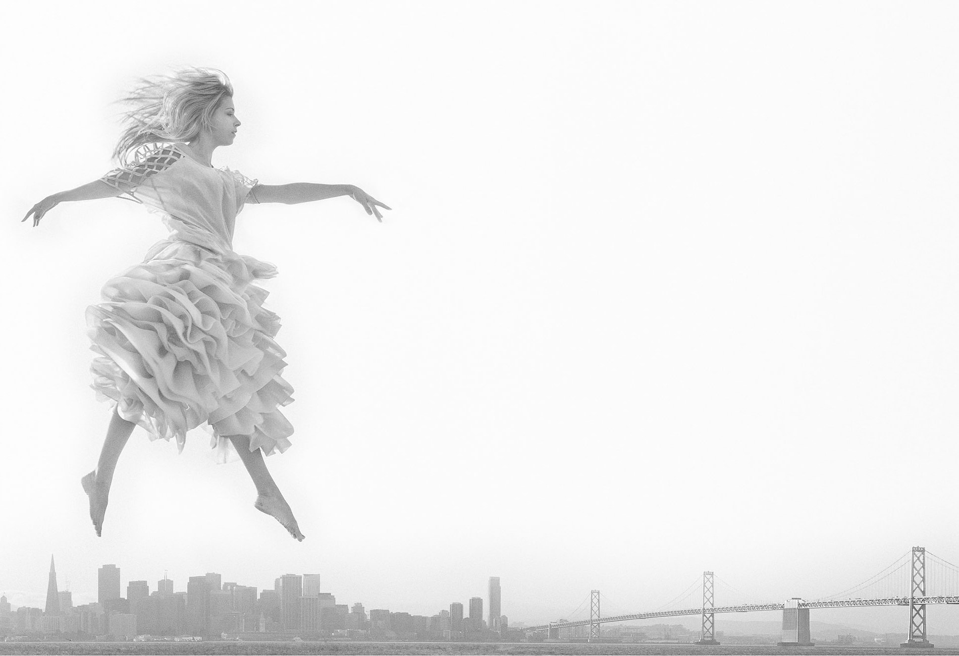 woman floating in the sky above NYC