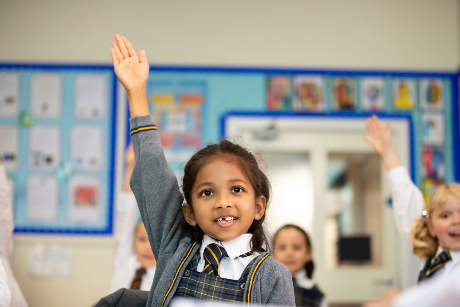 Confident learner answering a question in school
