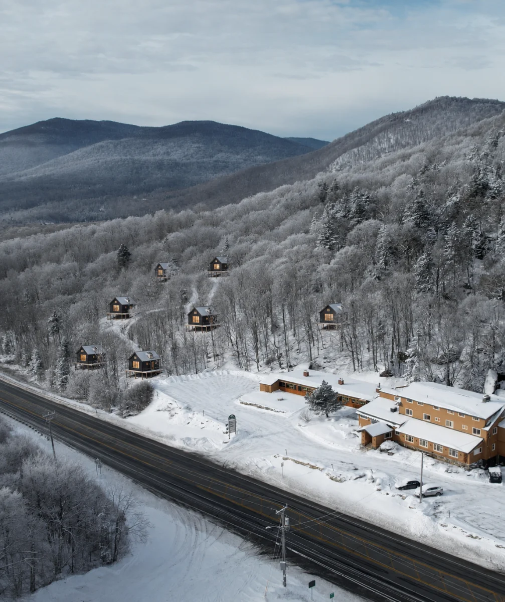 Winter aerial of the inn and cabins above Route 4