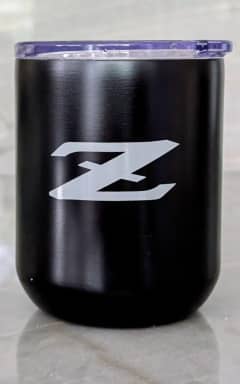 Black Nissan metal drink tumbler sporting a white Z emblem