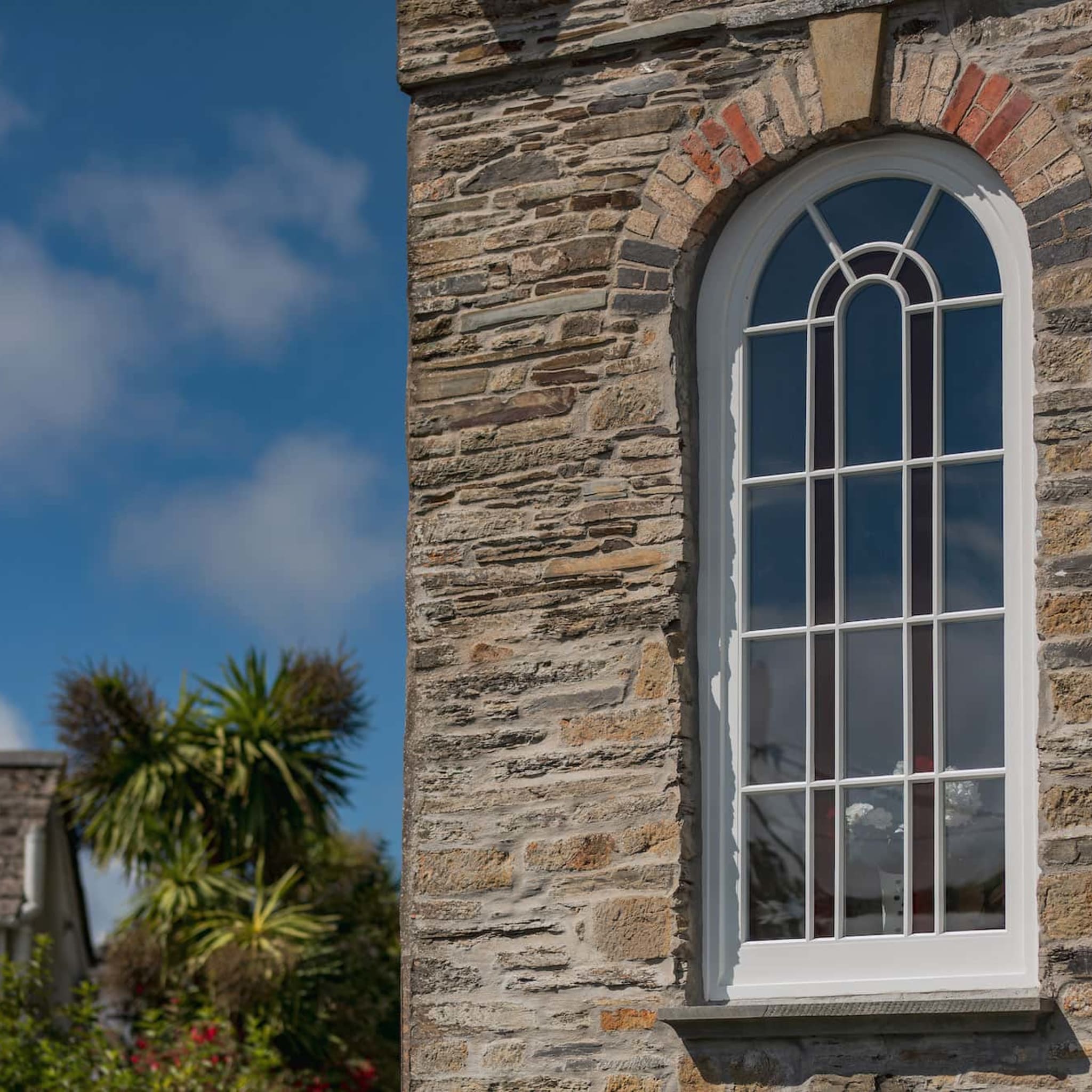 chapel glass external half view with blue sky | NMC