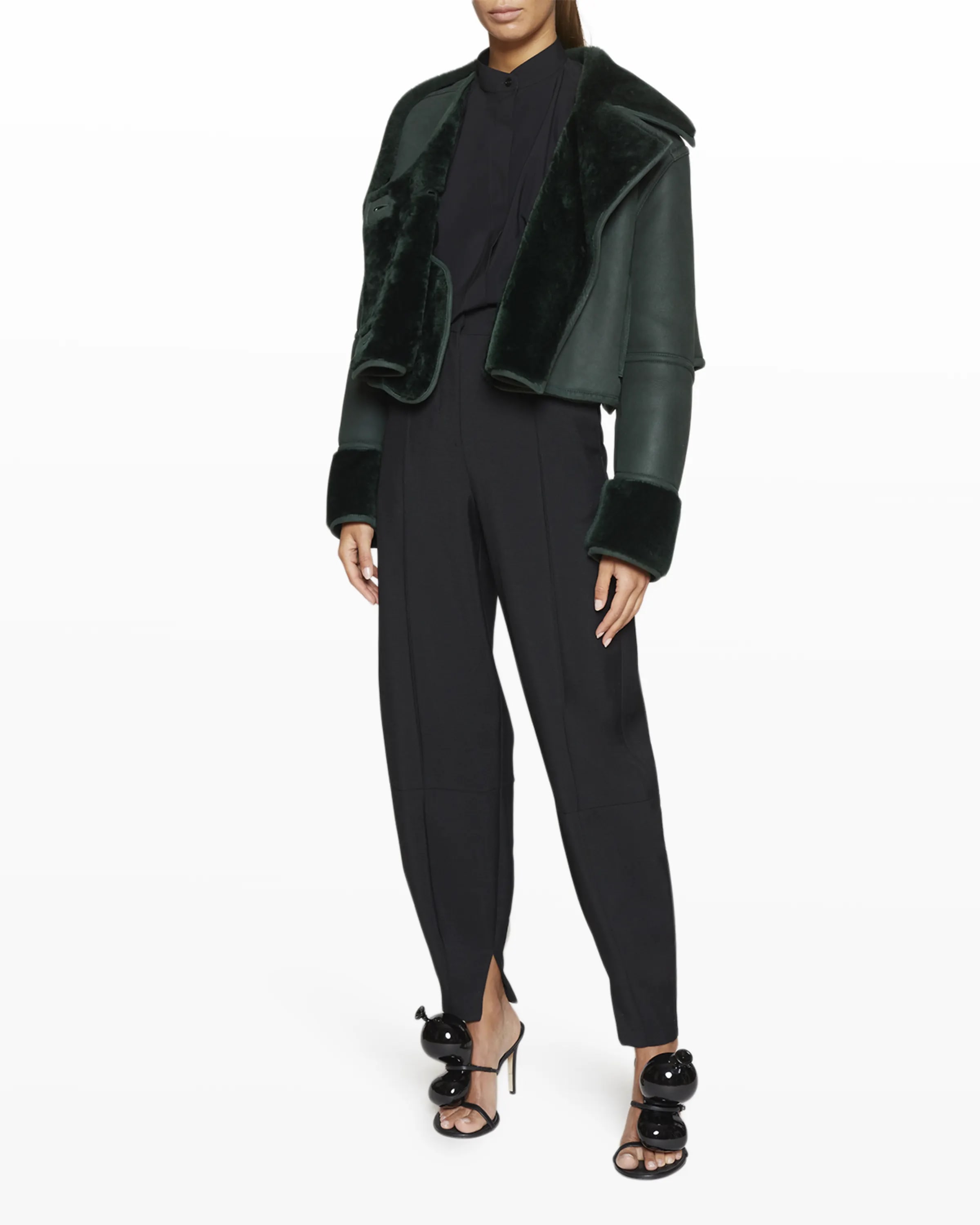 On-model image of a Loewe dark green shearling jacket