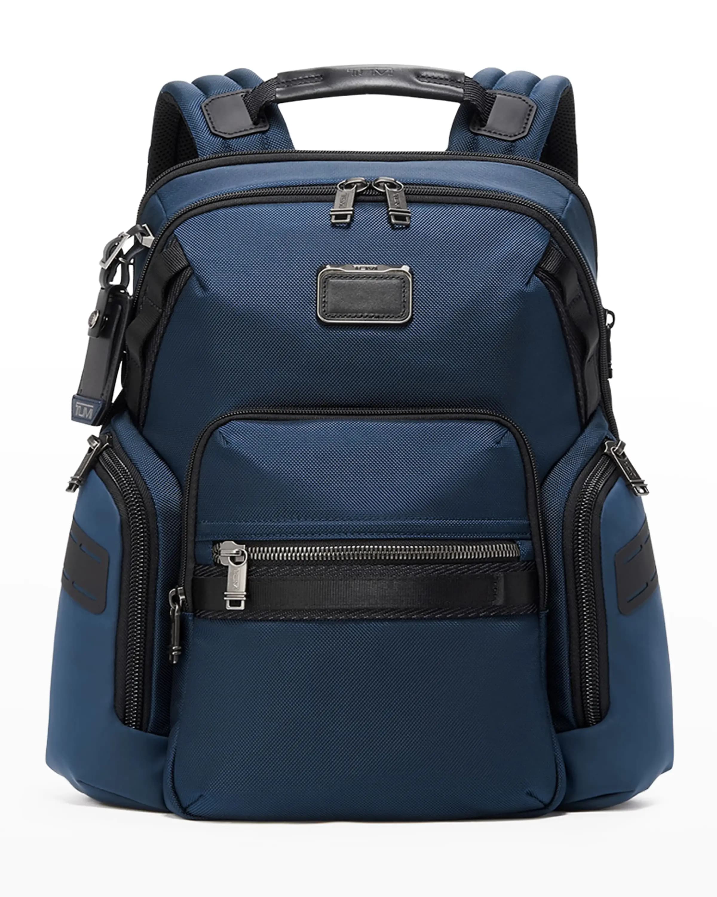 Ghost image of a TUMI navy blue ballistic nylon and leather backpack
