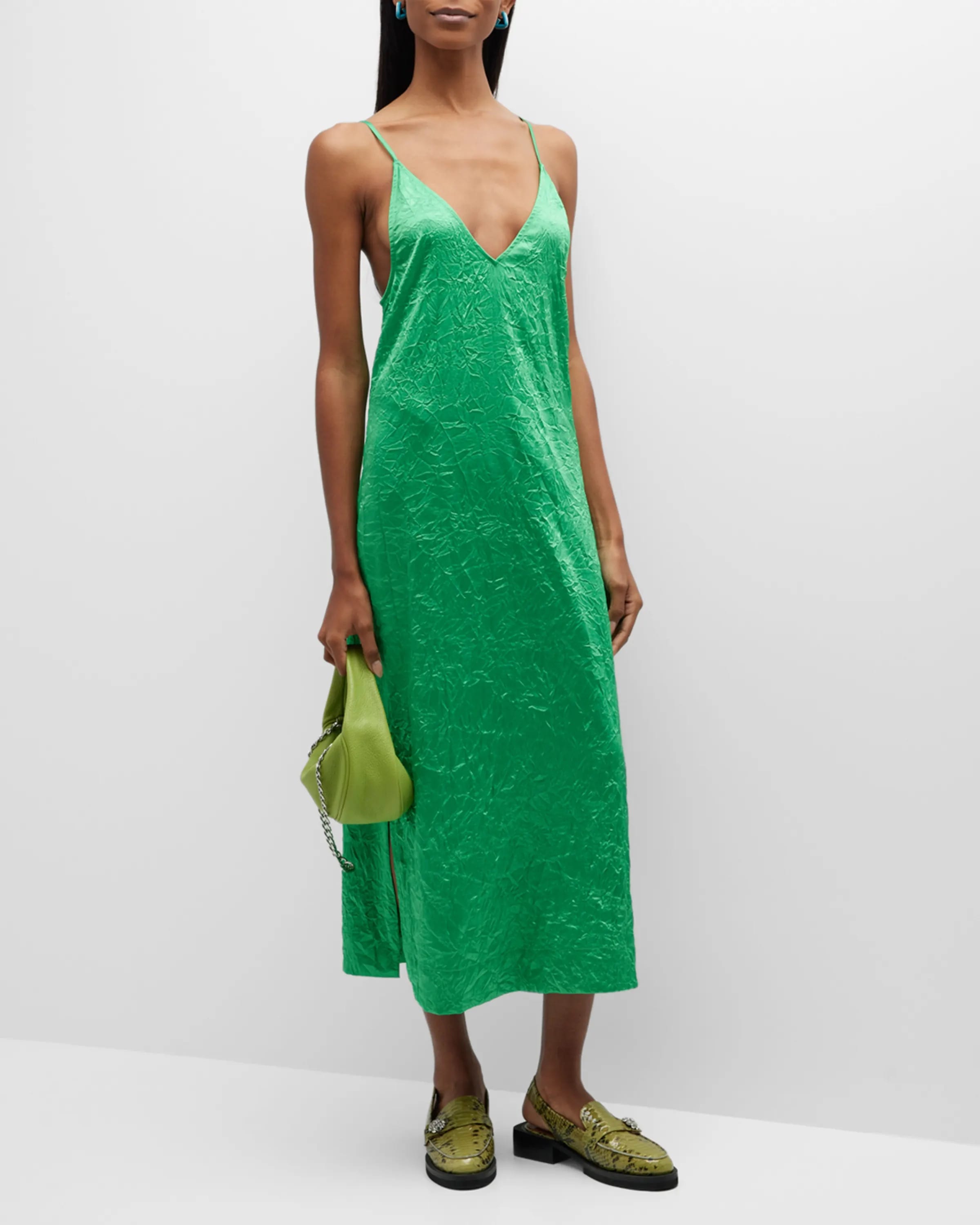 On-model image of a Ganni green recycled polyester/elastane slip dress