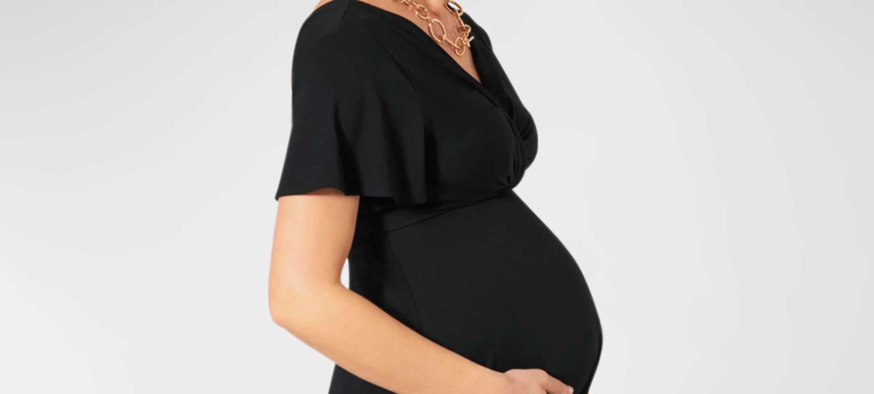 Pregnant woman in black maternity dress