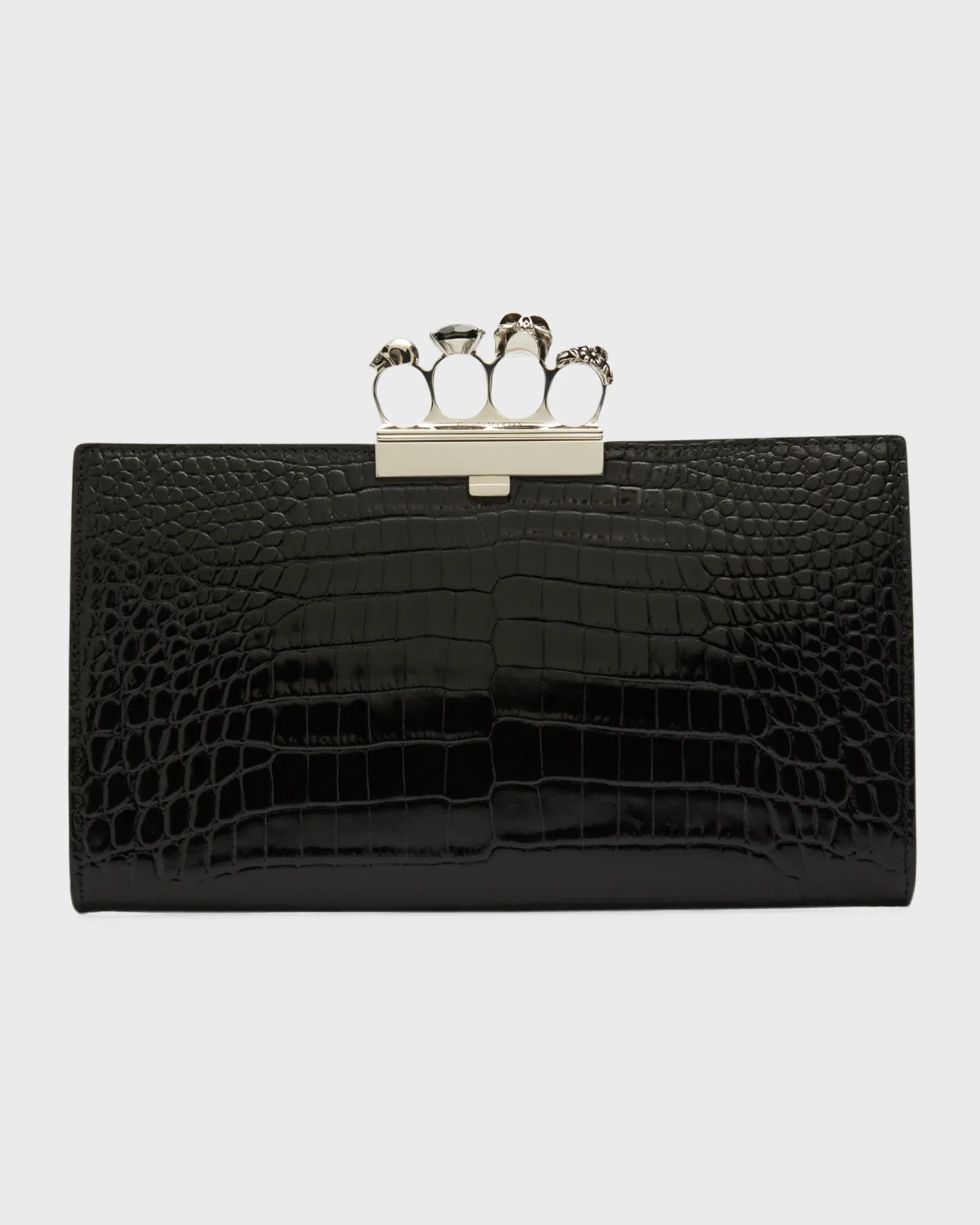 Ghost image of an Alexander McQueen black leather clutch