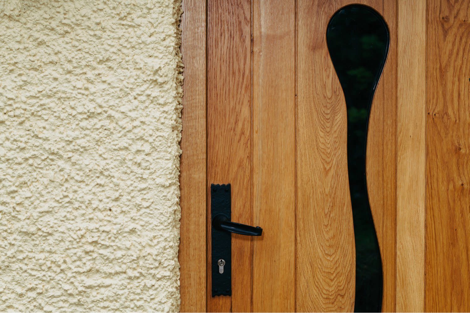 How To Choose The Perfect Timber Door For Your Home | Nathan McCarter Joinery custom made wooden front door with wave glass