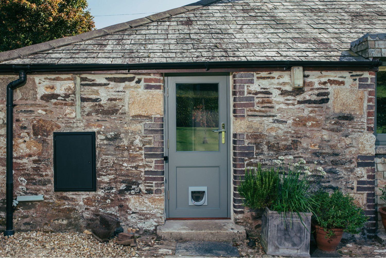 Door And Window Colour Trends For 2025 | Nathan McCarter Joinery timber door with cat flap