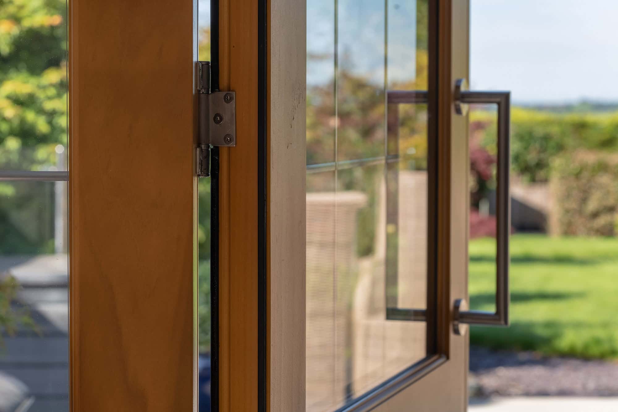 Bi-Fold Doors | Nathan McCarter Joinery detail view of hinges on timber bi-fold doors