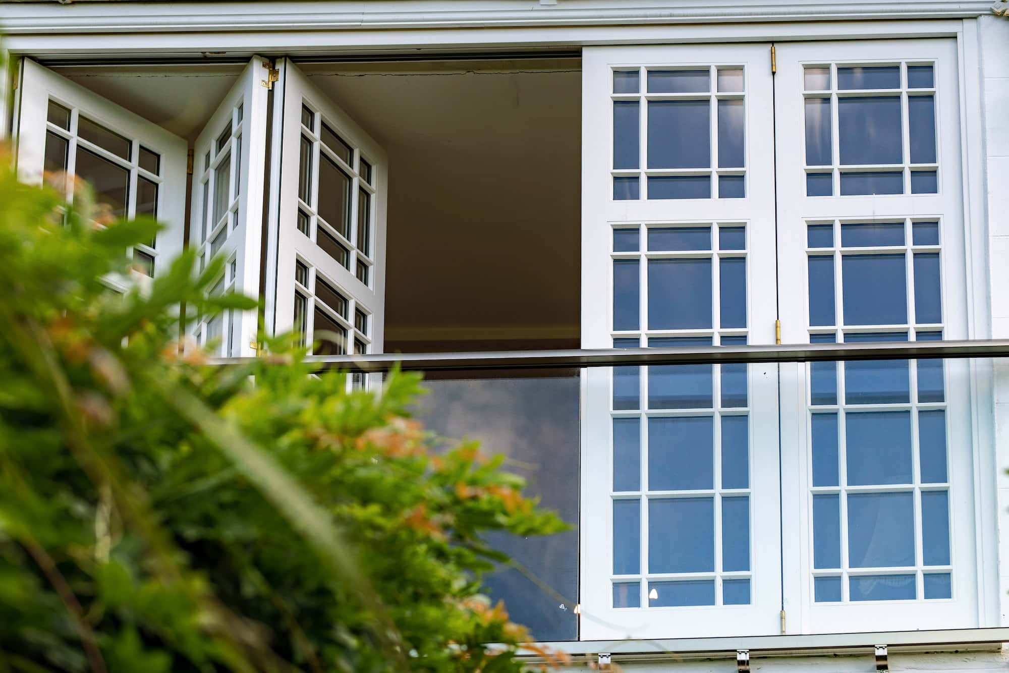 Bi-Fold Doors | Nathan McCarter Joinery Timber bi-fold doors open from garden
