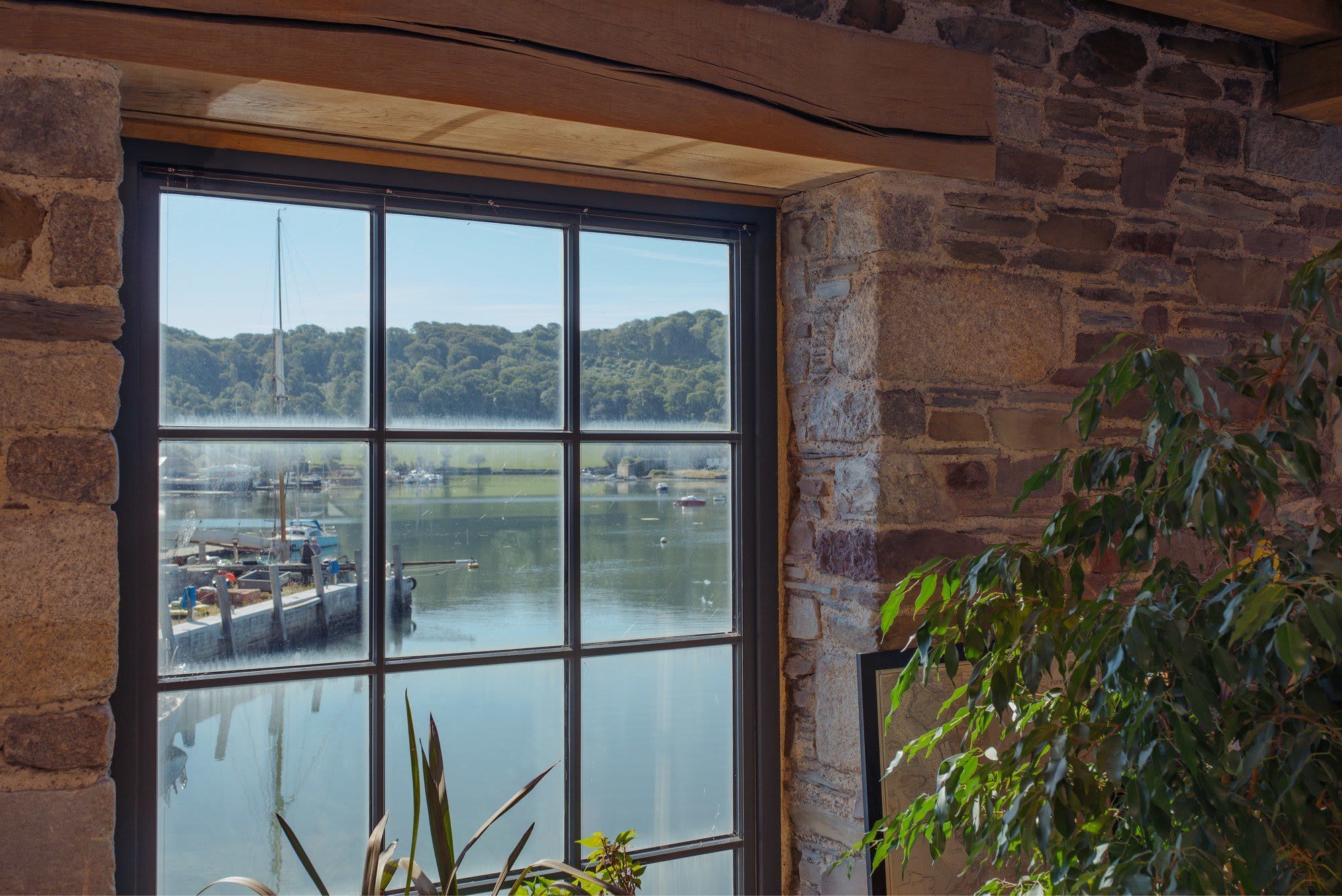 The Best Wood Replacement Windows For Coastal Homes | Nathan McCarter Joinery bespoke timber window by the sea