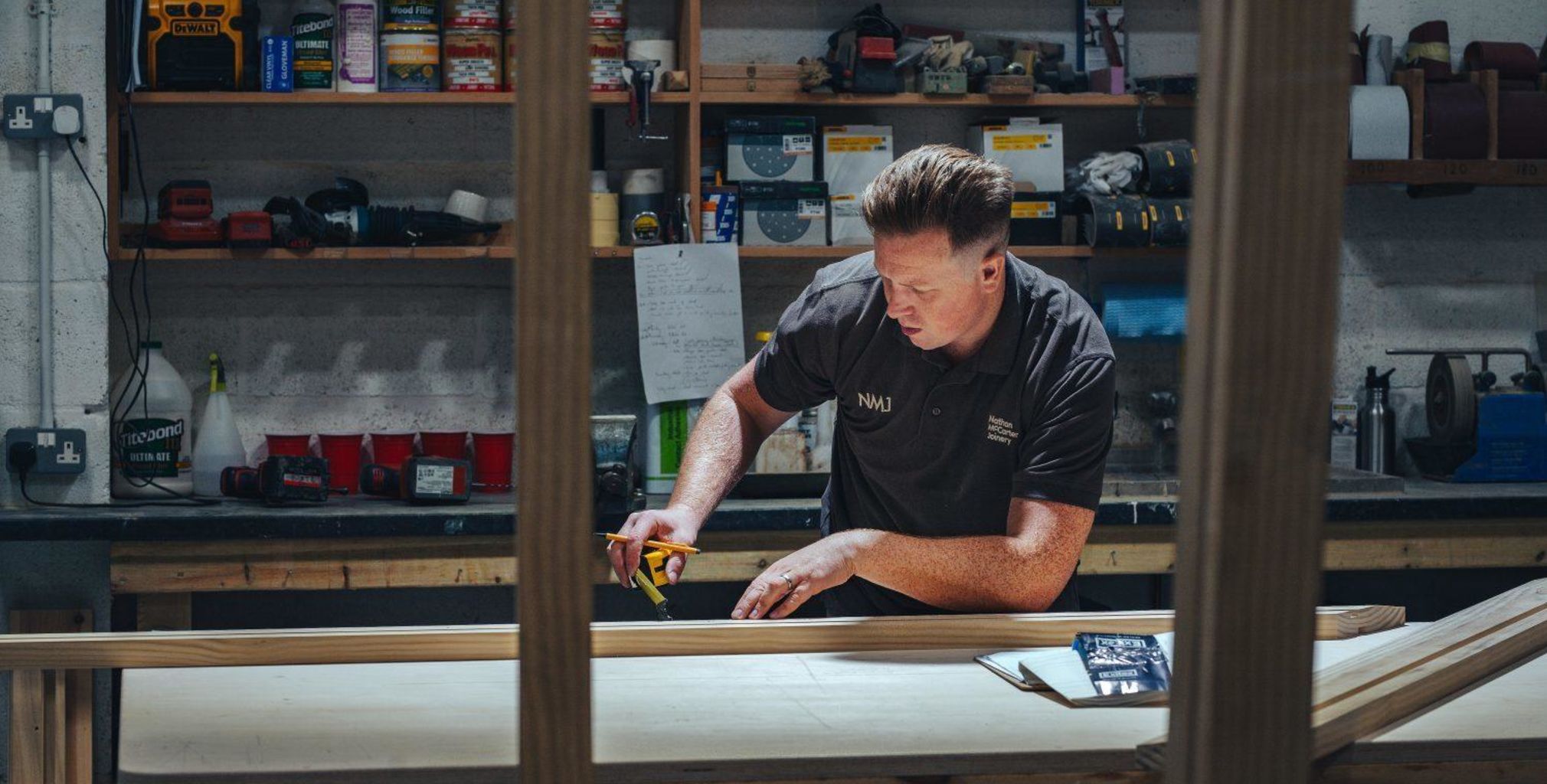 Nathan McCarter working on a bespoke timber window