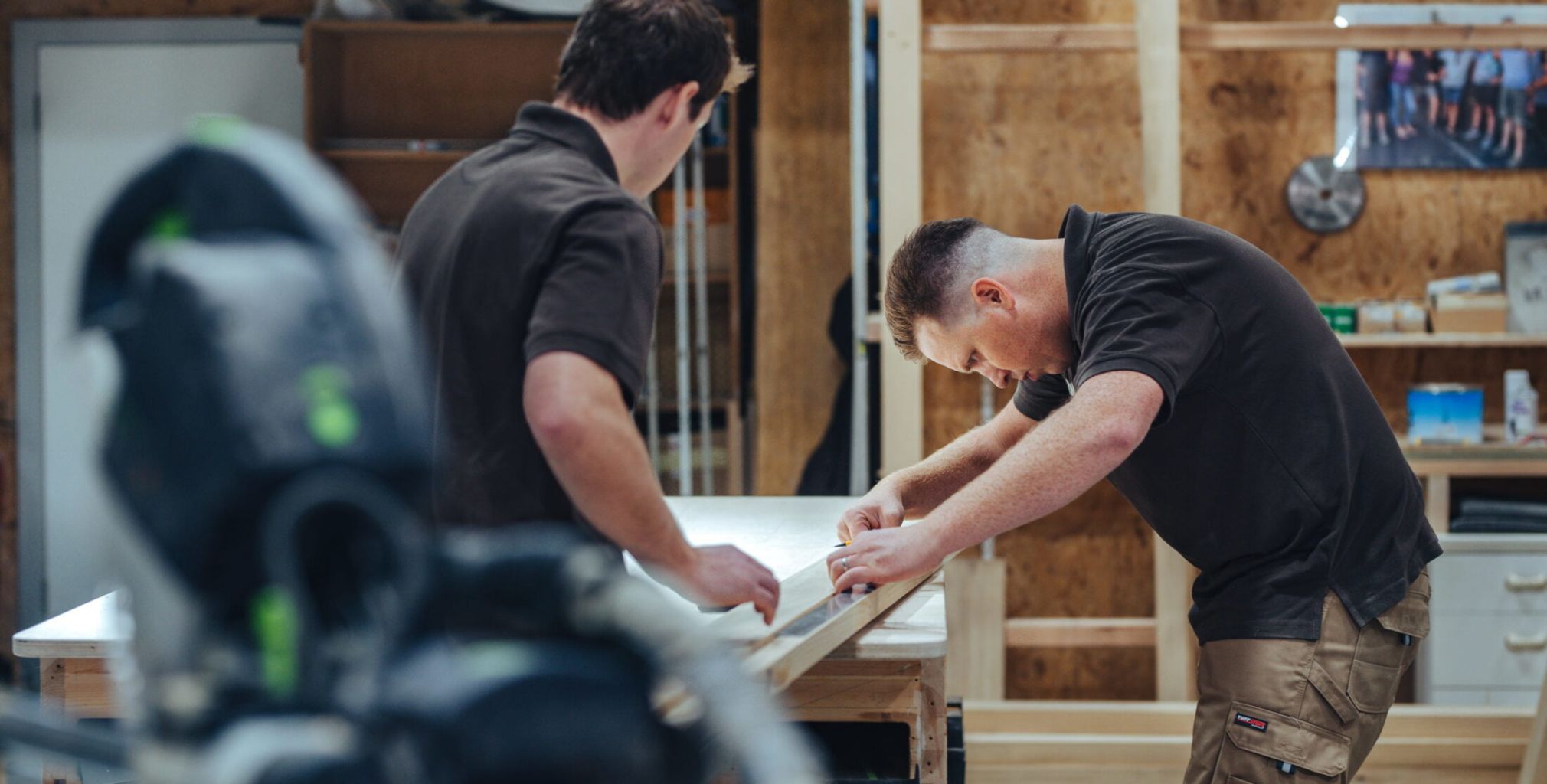 Nathan McCarter measuring a timber door