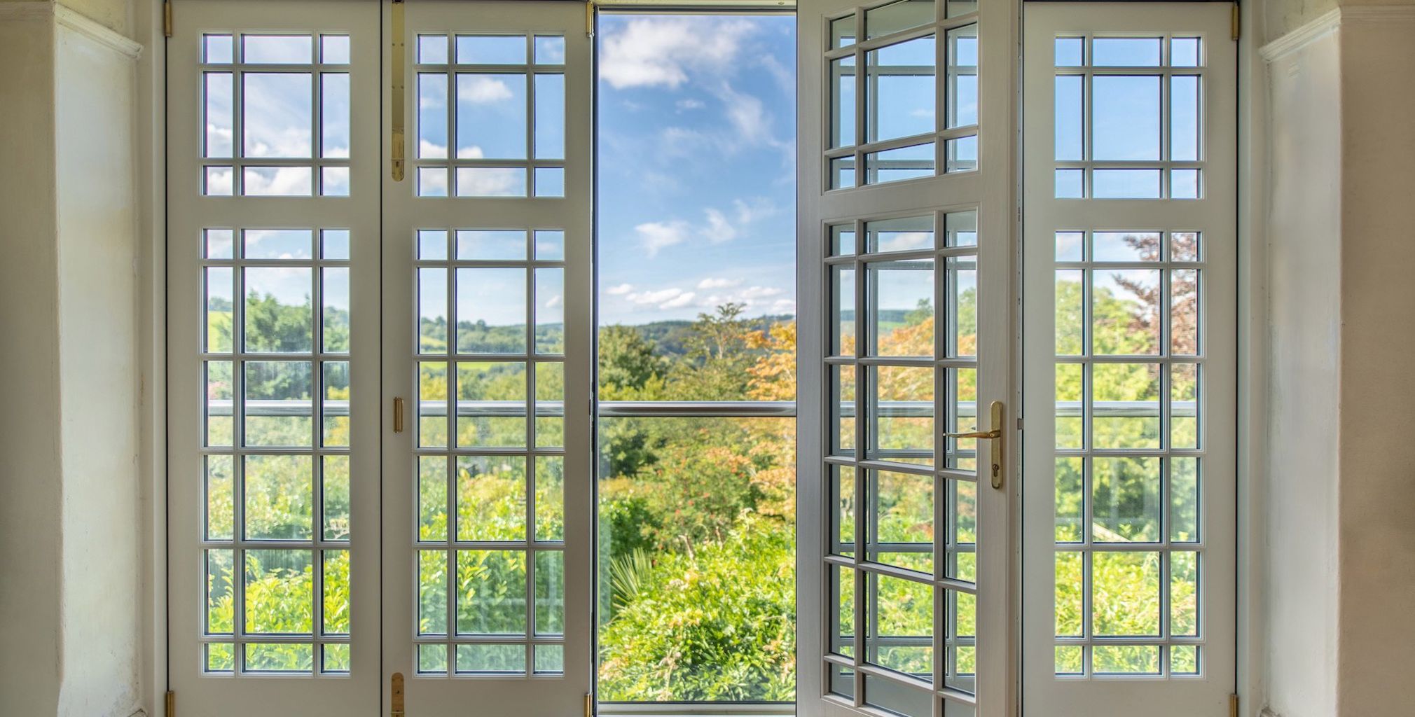 bi fold timber doors with bars internal view door open