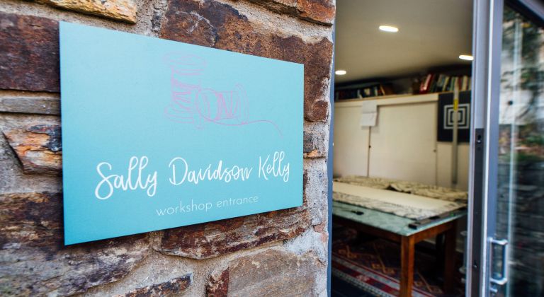 Sally Davidson Kelly plaque wide open door