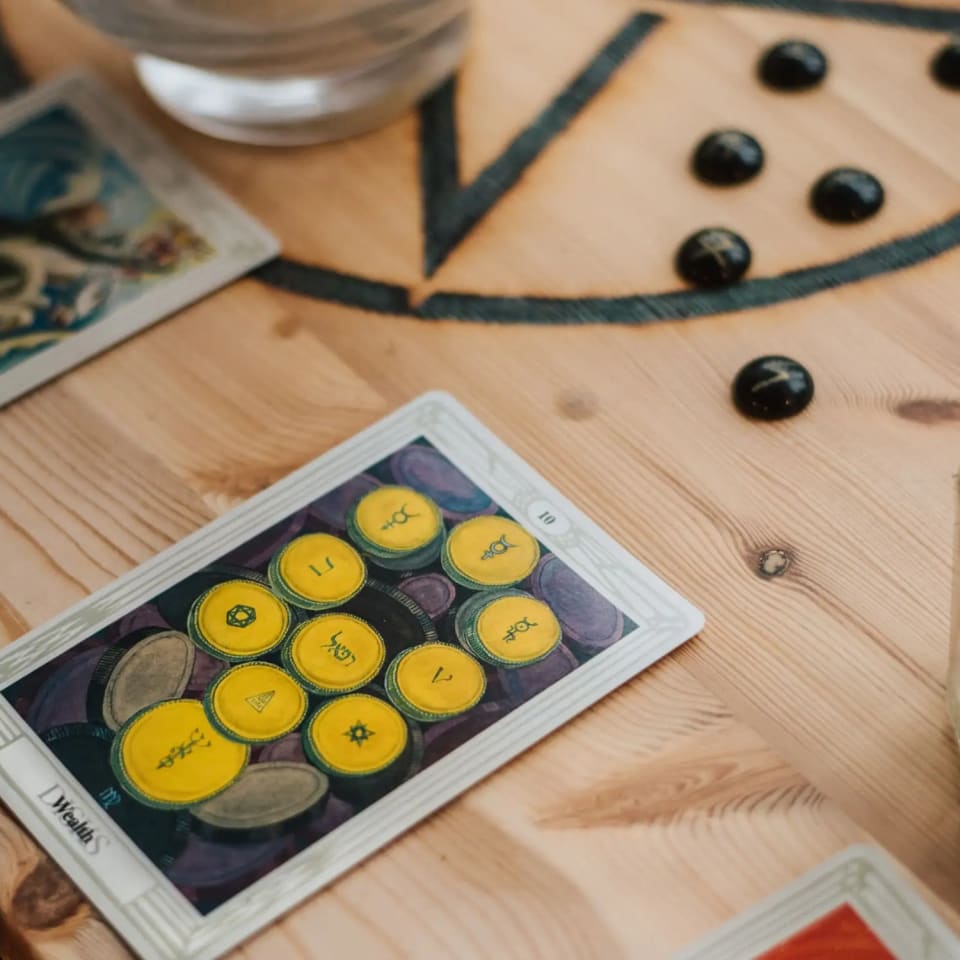 Tarot Cards beside a candle