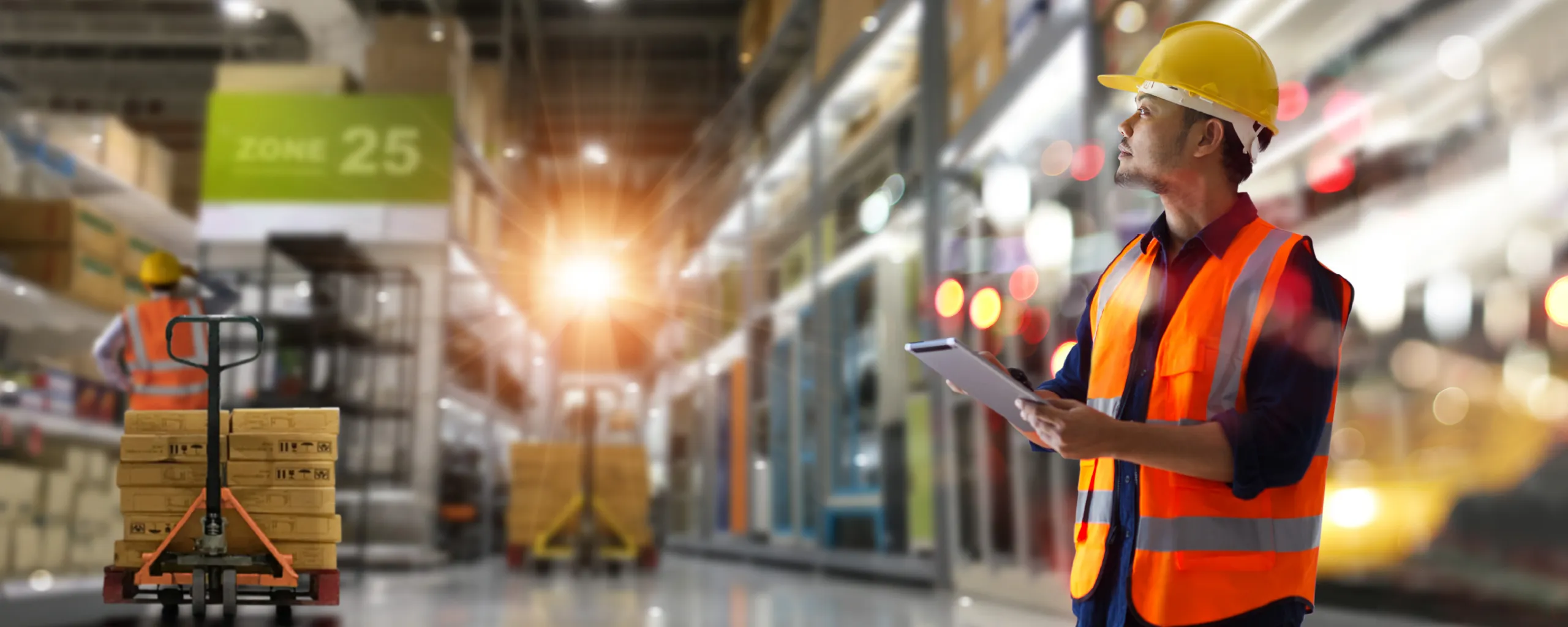 Warehouse employee using a tablet to manage inventory and fulfillment workflows