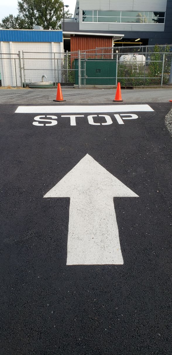 Enterprise parking line paint project 5 Big directional arrow at parking lot