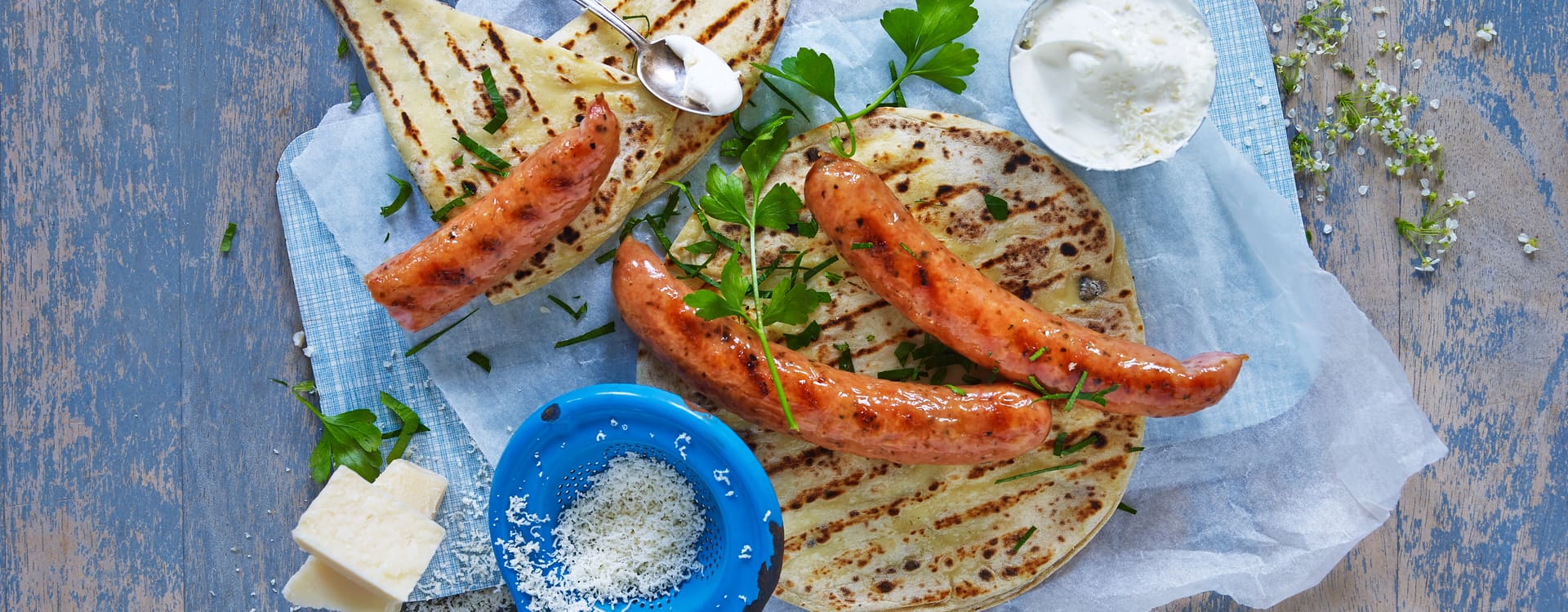 Krydderpølse med hvitløk, parmesankrem og lompe