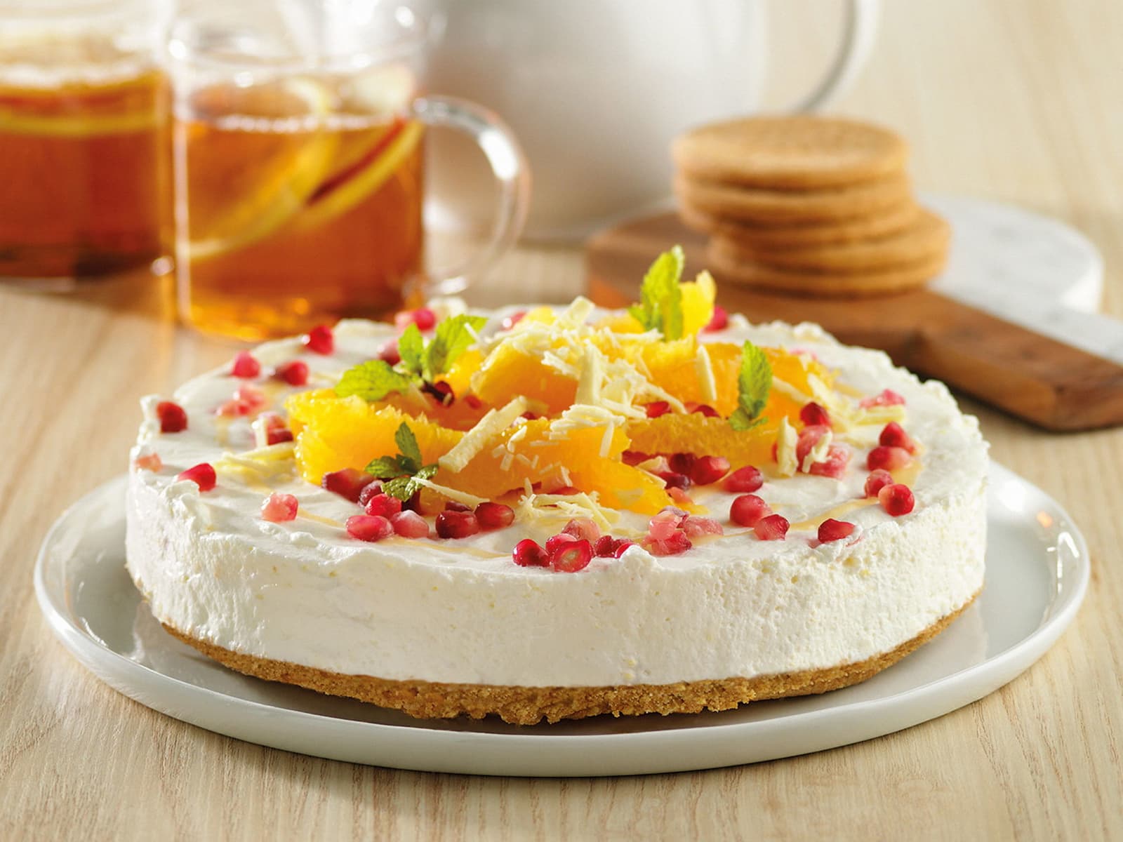 Ostekake med sitron og granateplekjerner