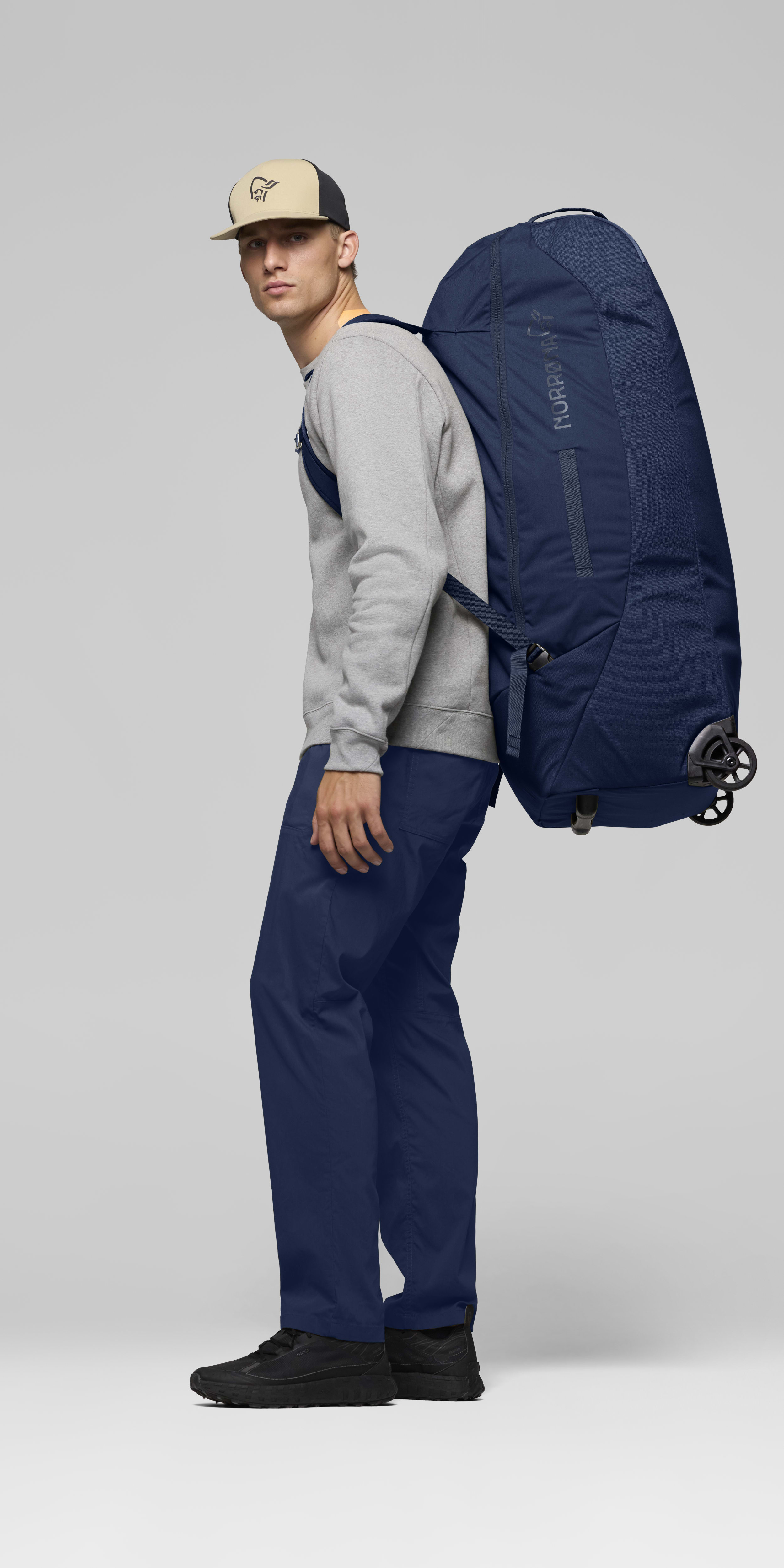 Female Look back image of norrona 120L Trolley Bag Indigo Night