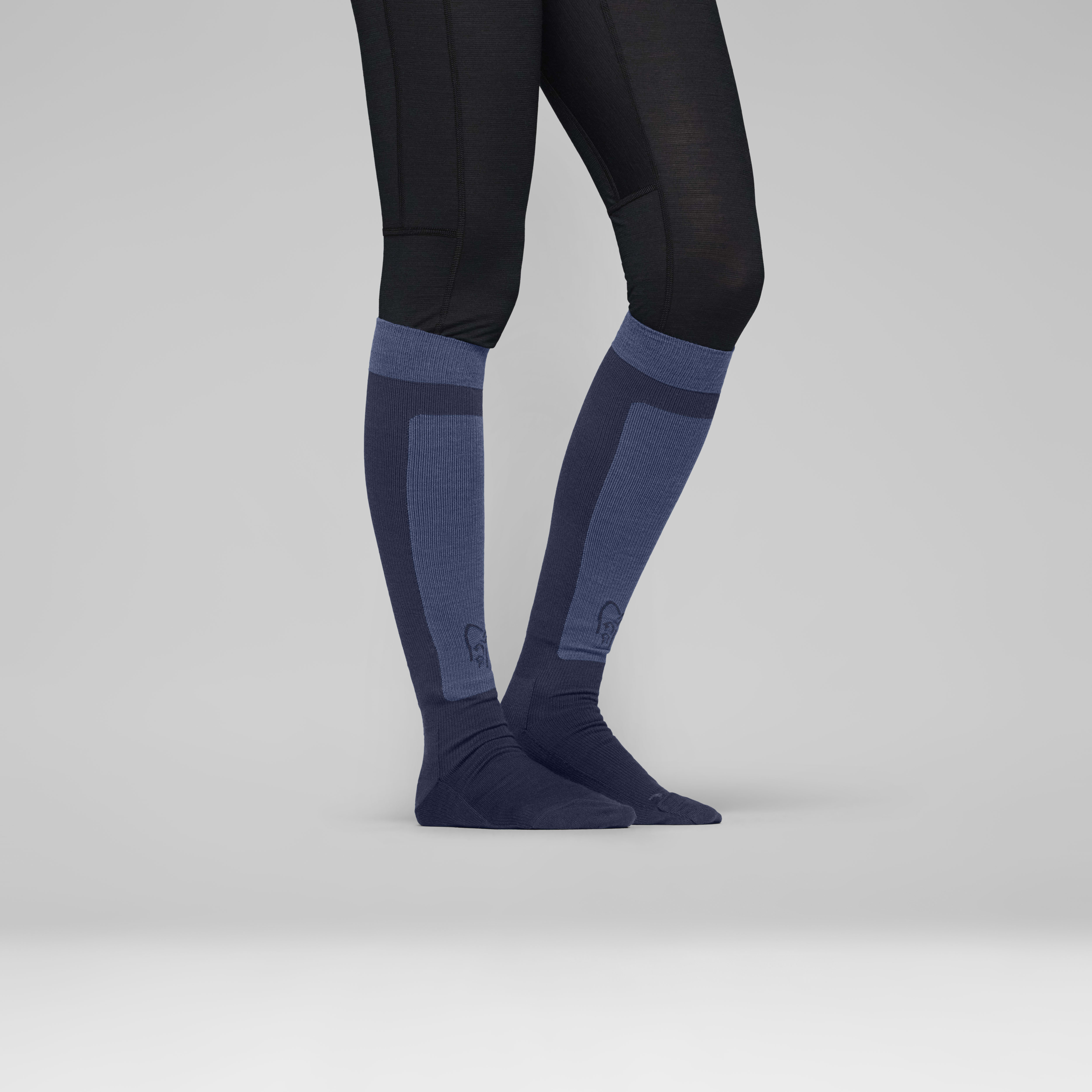 Female Look back image of lyngen light merinoUll long Socks Indigo Night/Dark Denim