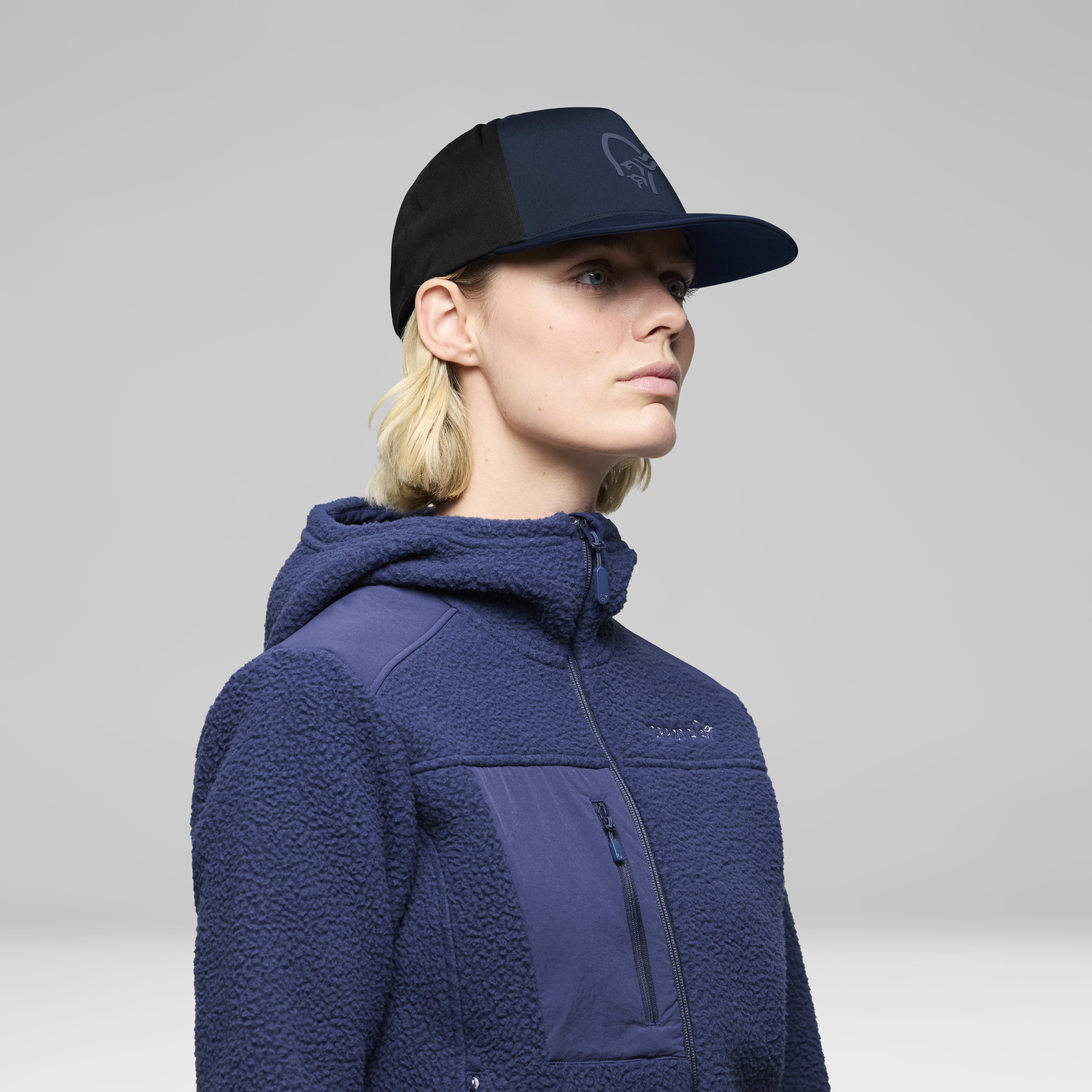 Female Look back image of 29 tech trucker Cap Indigo Night
