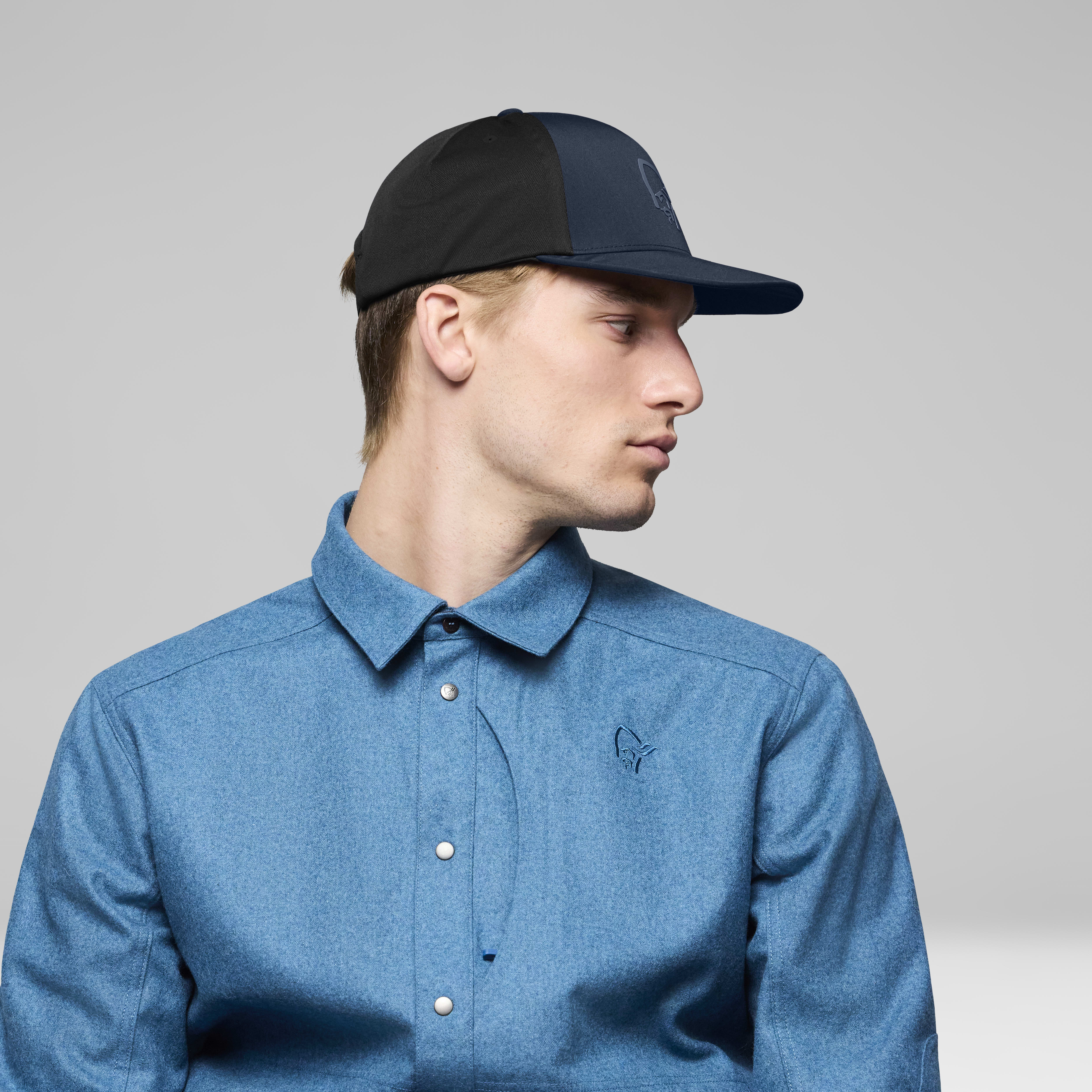 Female Look back image of 29 tech trucker Cap Indigo Night