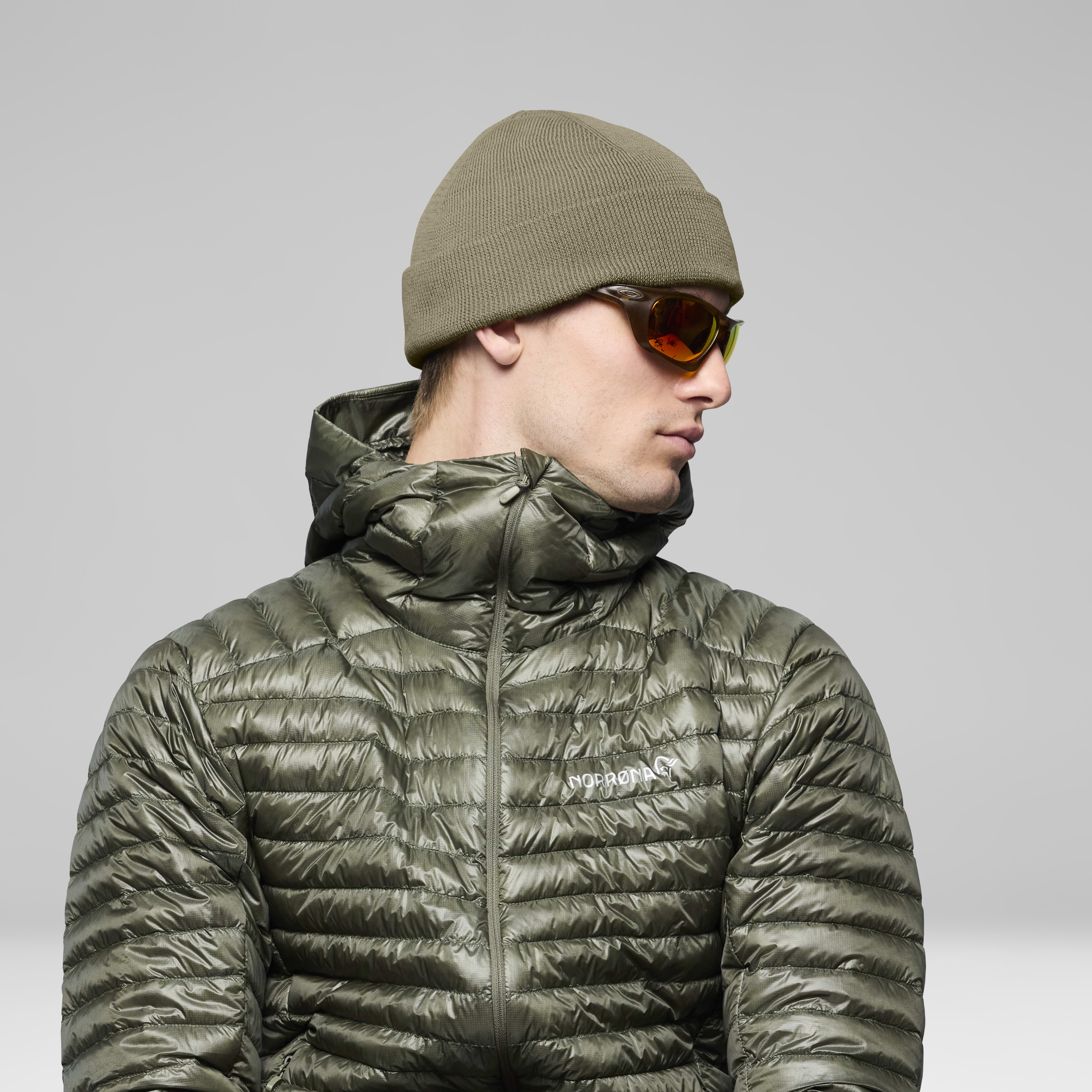 Female Look back image of 29 equaliser Beanie Deep Lichen Green