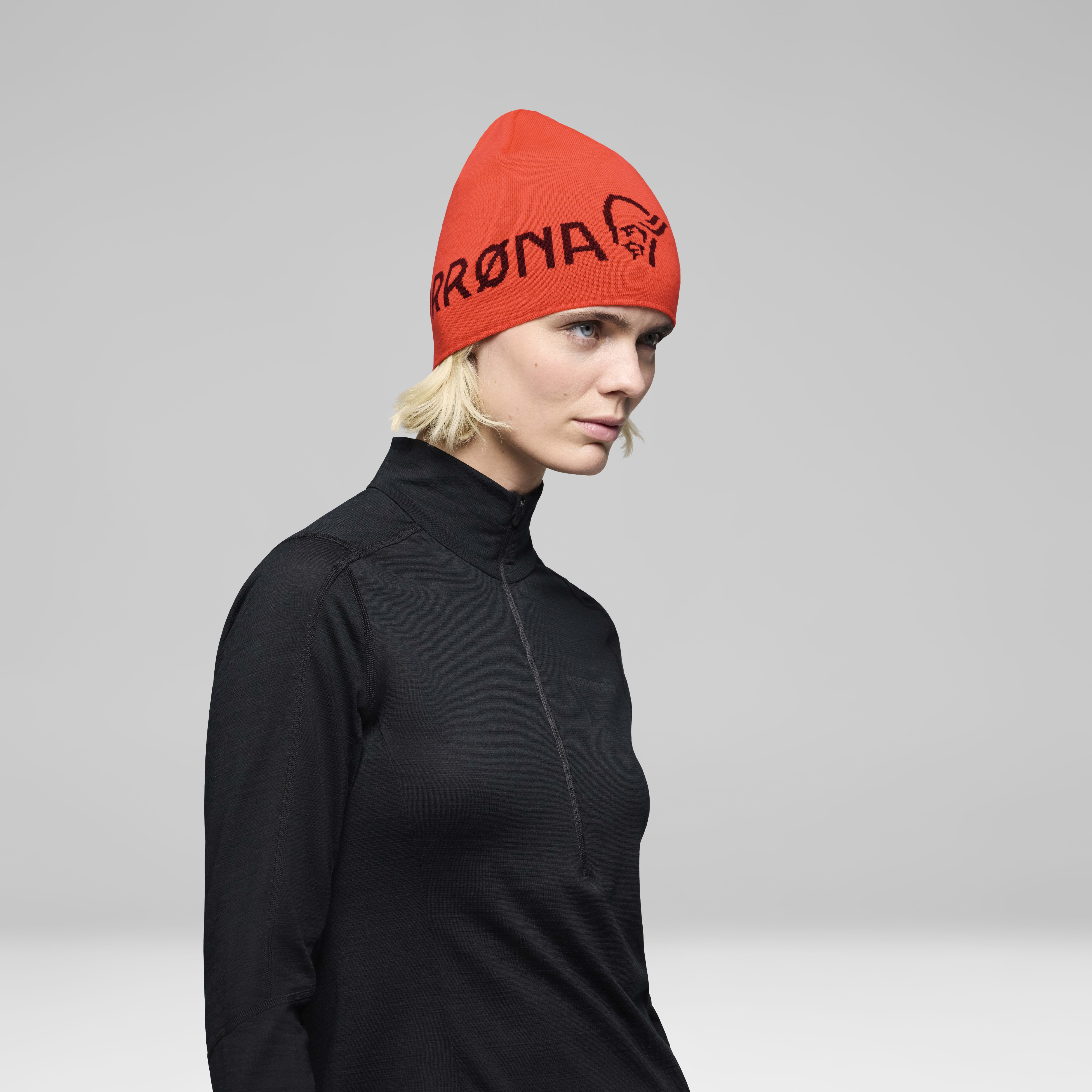 Female Look back image of 29 light merinoUll logo Beanie Baked Apple