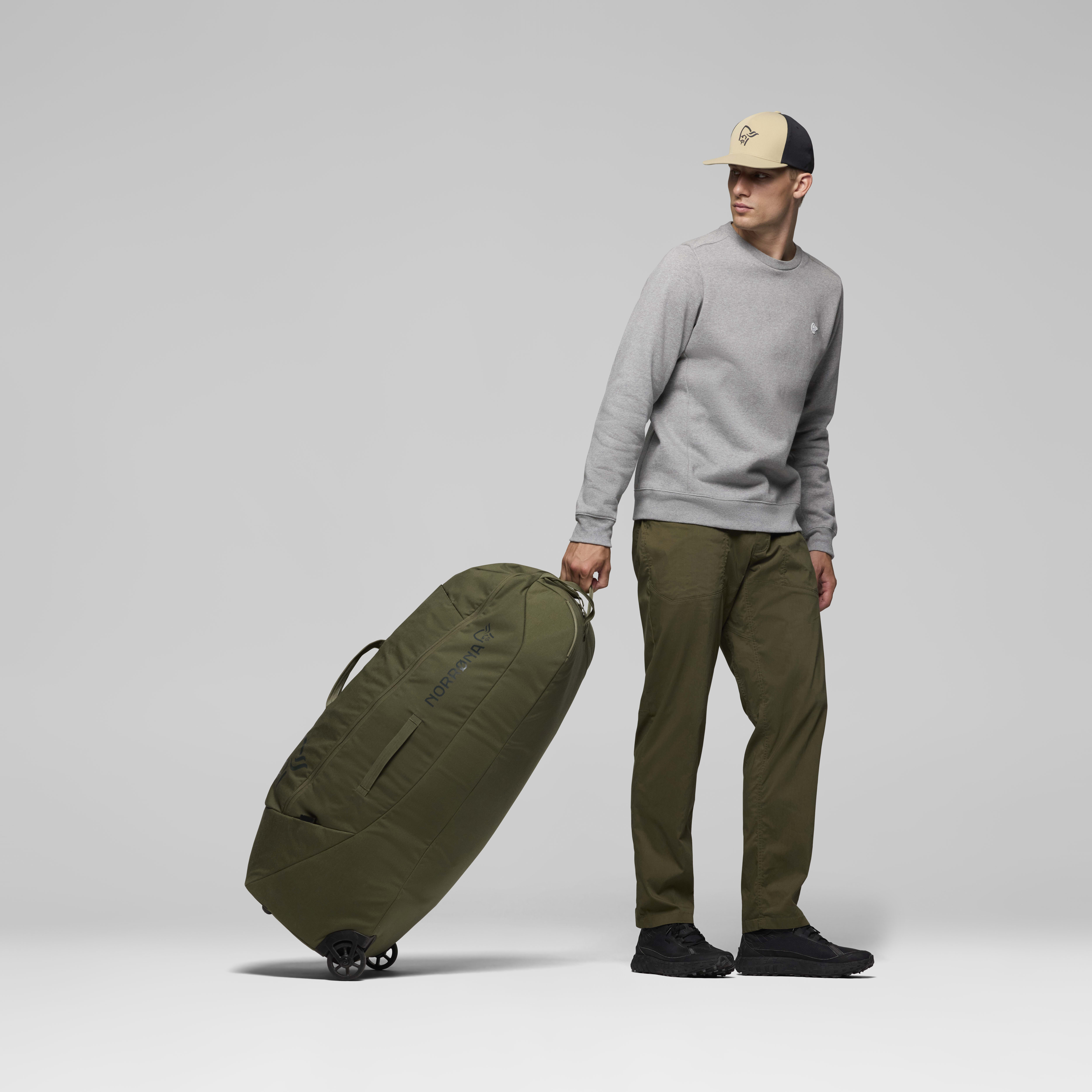 Female Look back image of norrona 120L Trolley Bag Olive Night