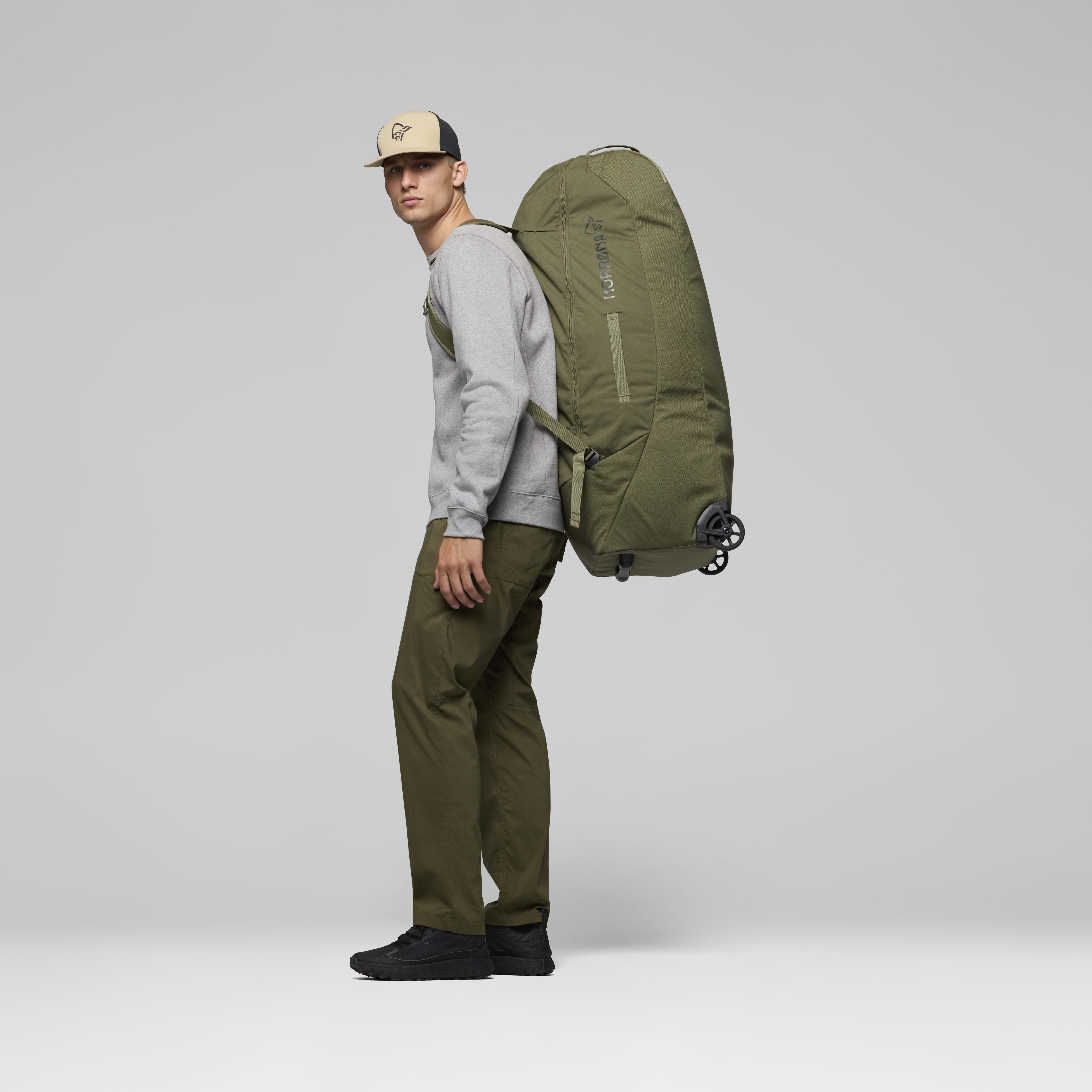 Female Look back image of norrona 120L Trolley Bag Olive Night