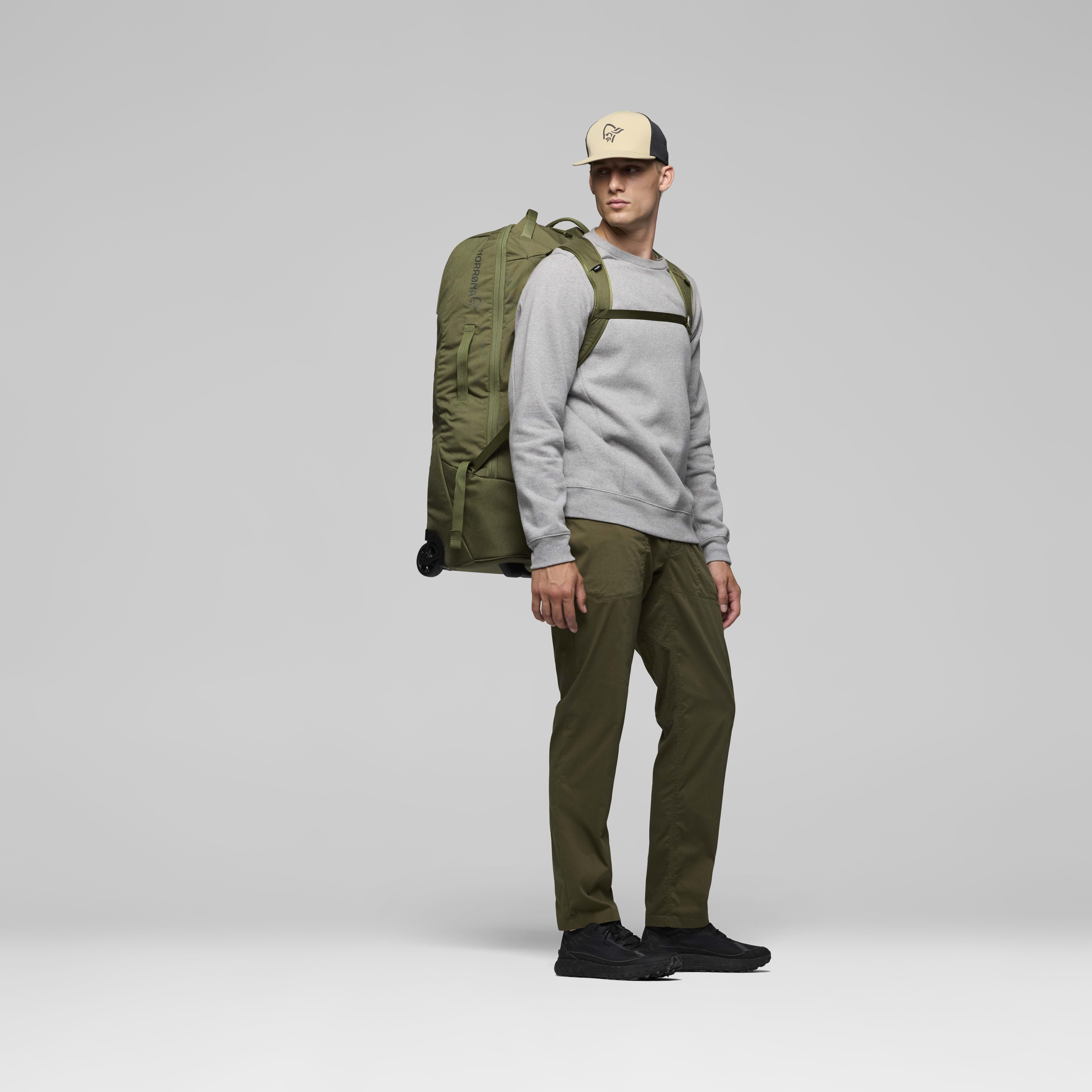 Female Look back image of norrona 80L Trolley Bag Olive Night