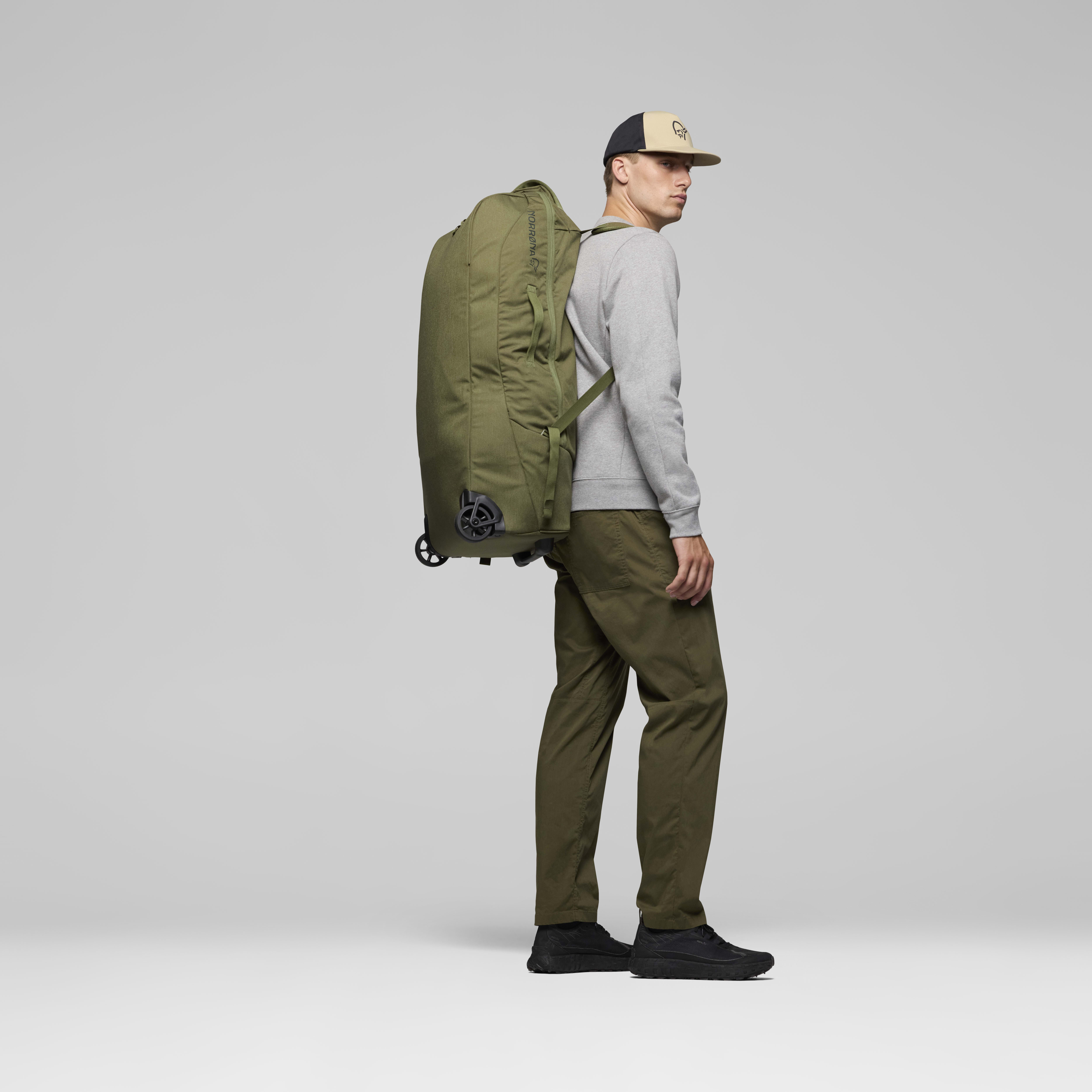 Female Look back image of norrona 80L Trolley Bag Olive Night