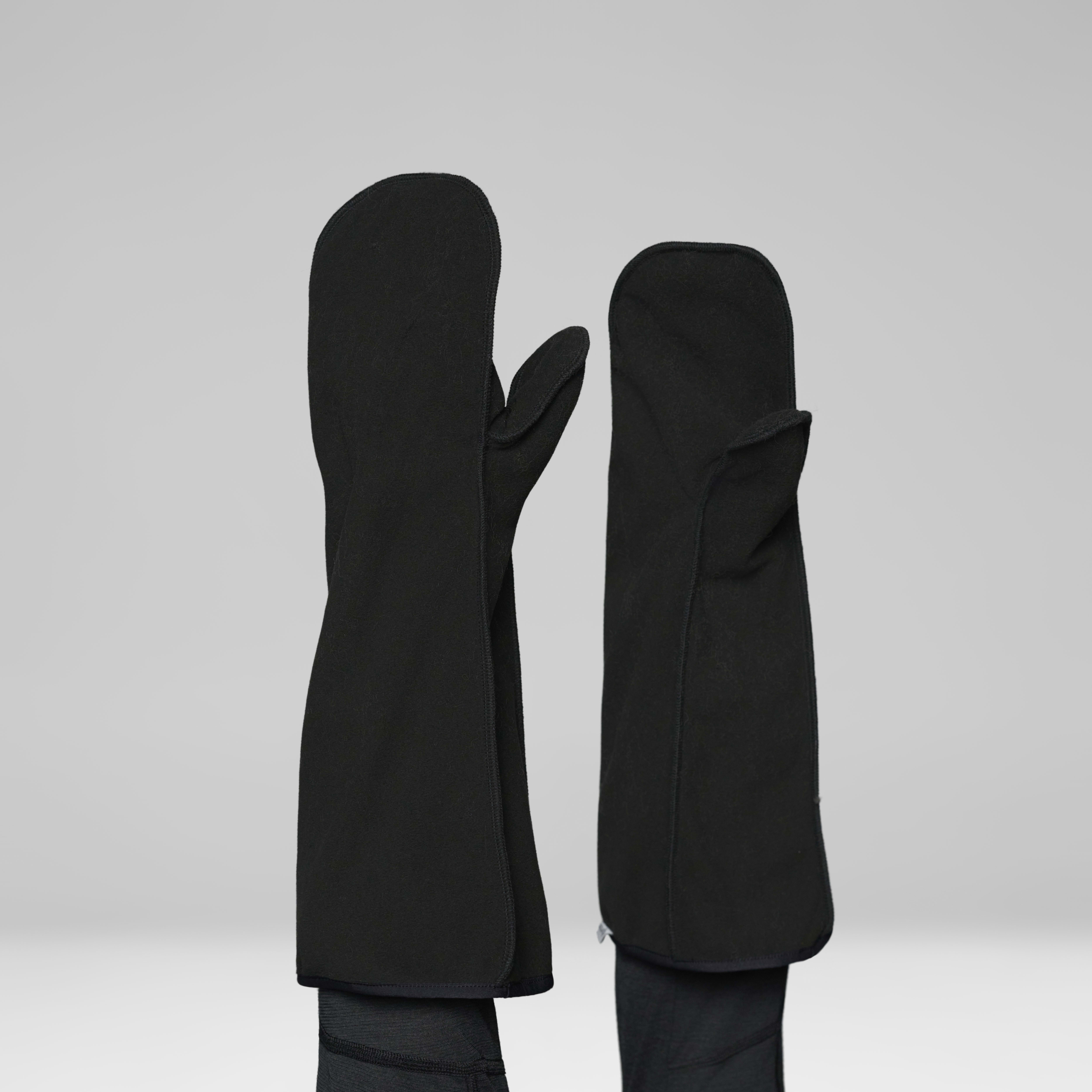 Female Look back image of arktis Gore-Tex Ousland Edition Mittens Caviar Black