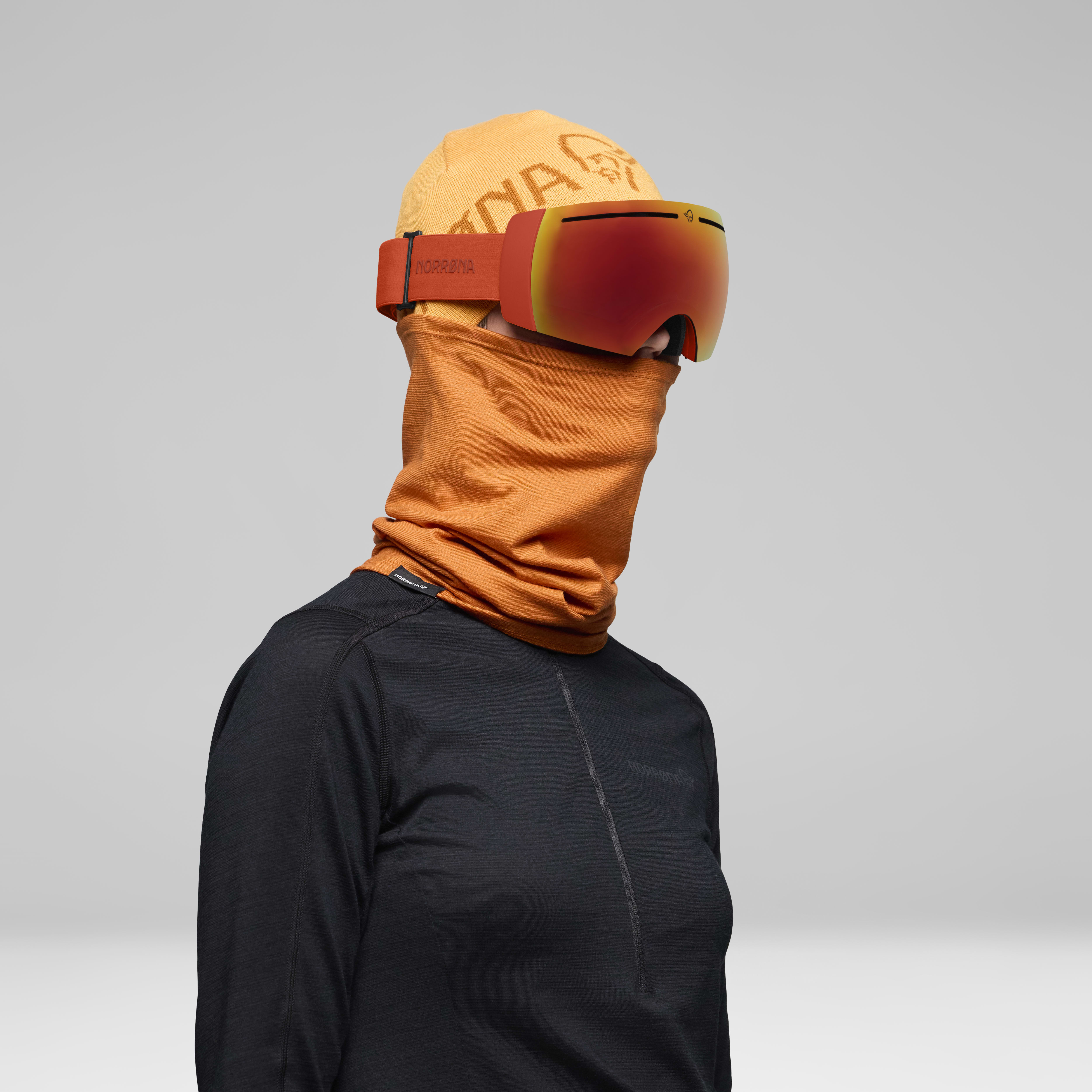 Female Look back image of lofoten Goggles Scarlet Ibis/Gold Fusion Mirror S2