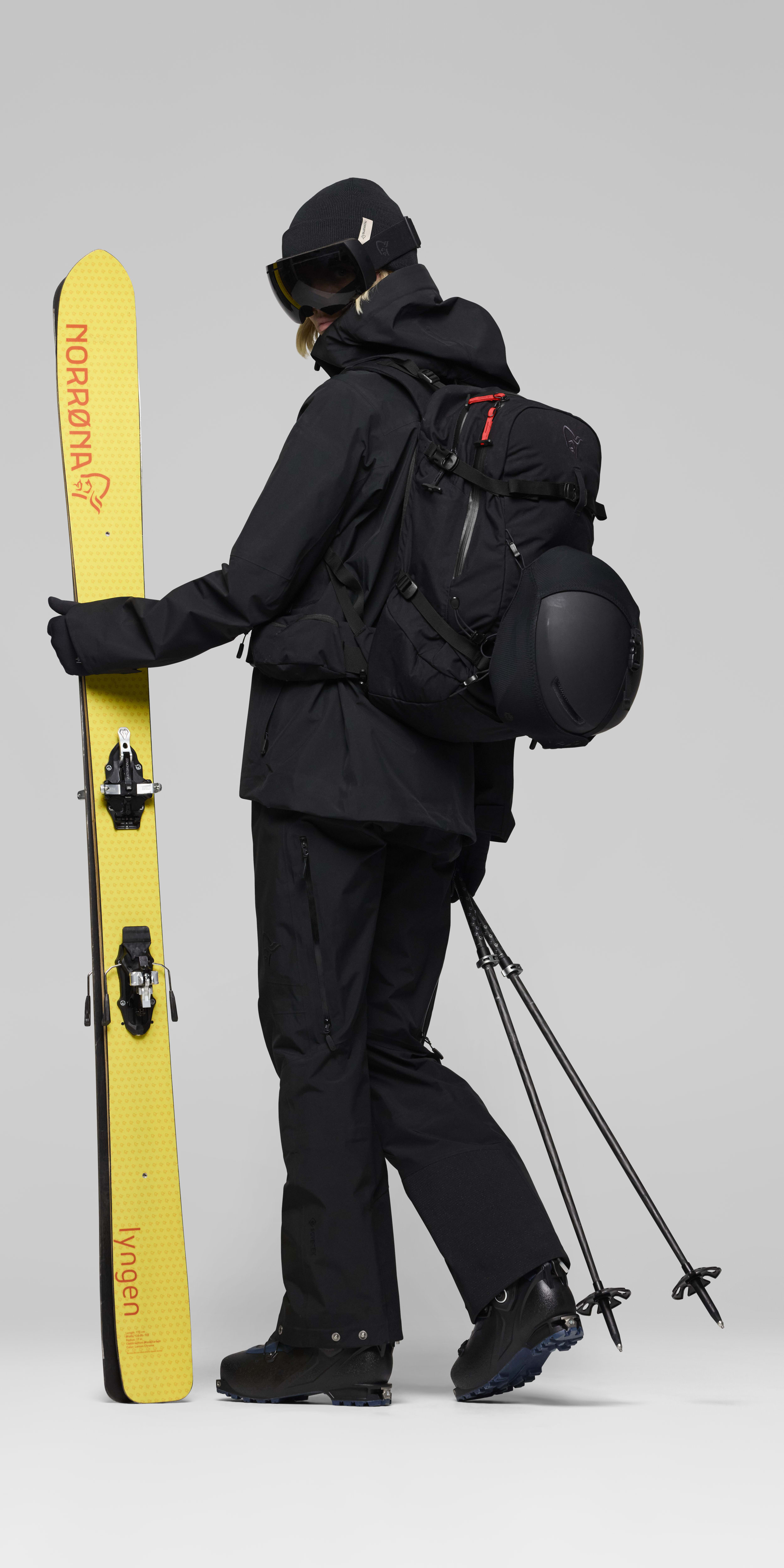 Female Look opening image of lofoten 28L Pack Caviar Black